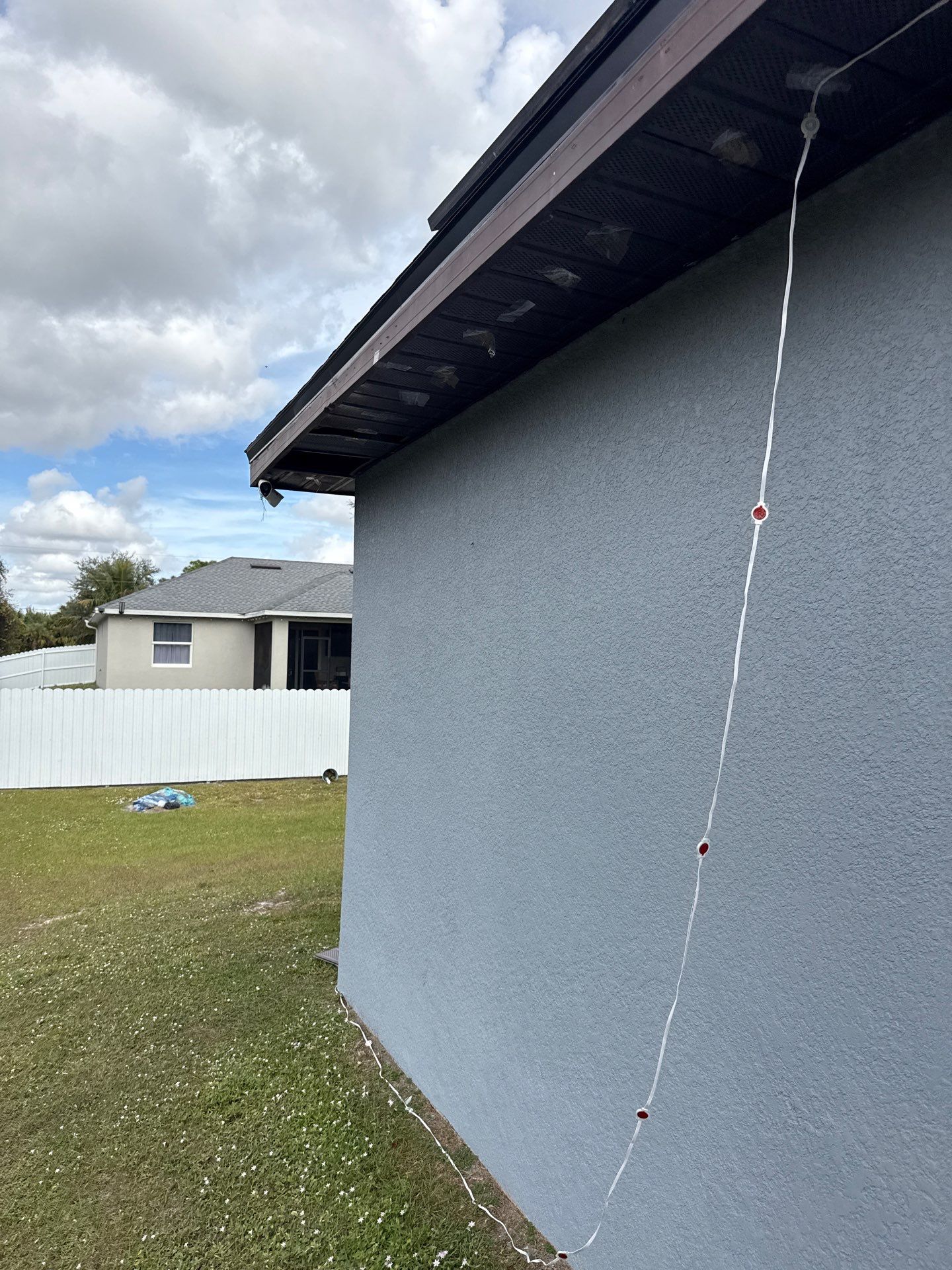 Black Seamless Gutters & Soffit/Fascia in Lehigh Acres FL by Gutter Professors