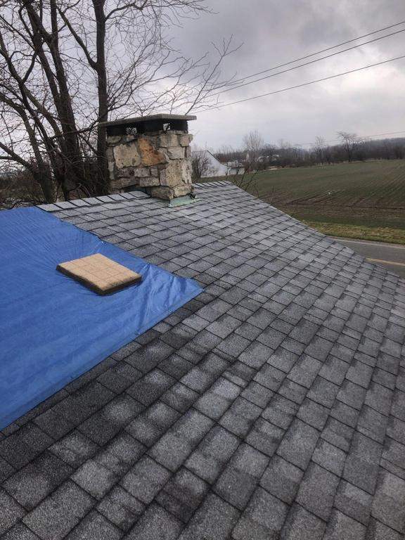 Storm damage roof replacement by Nitro Roofing and Construction