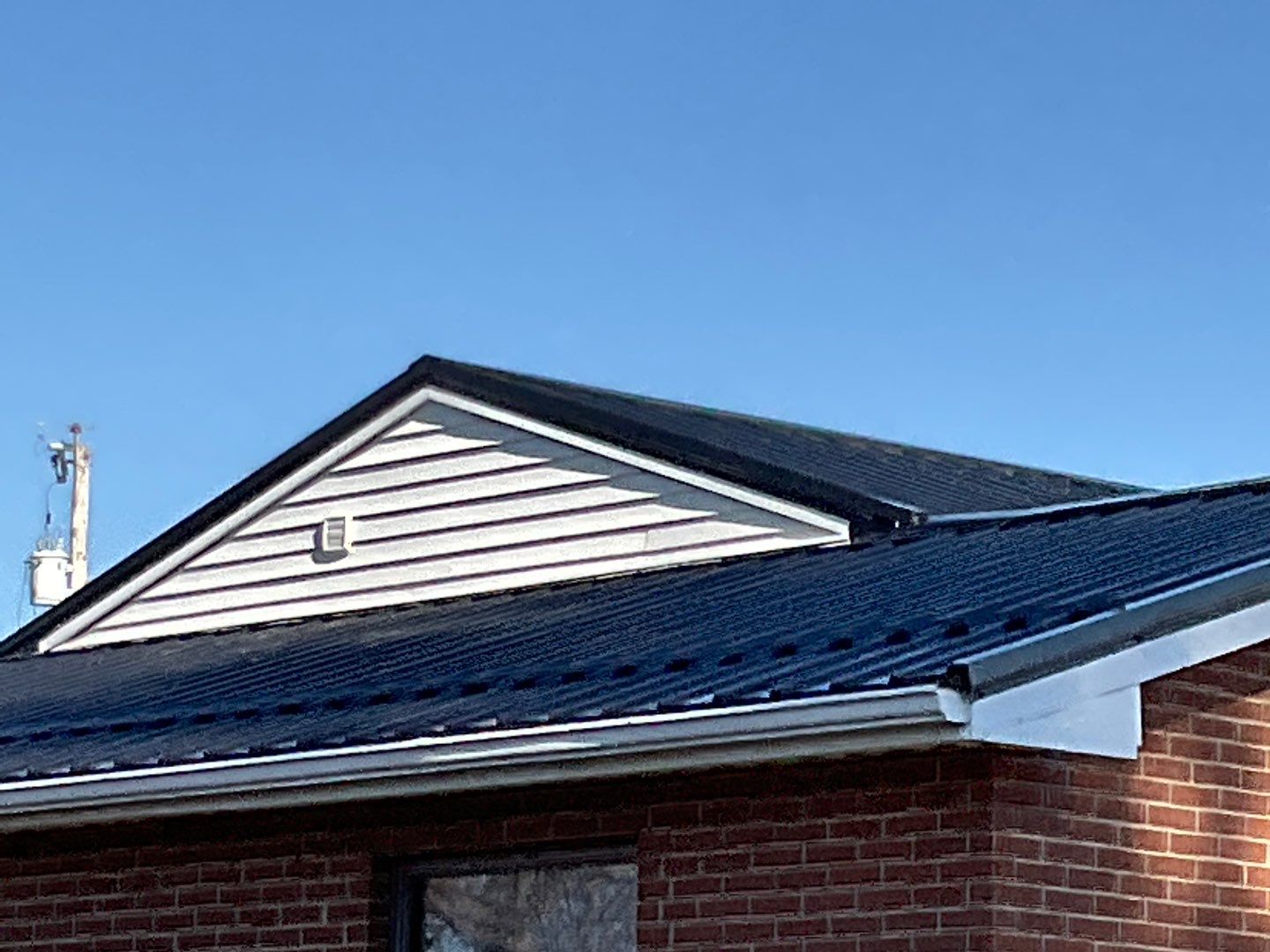 Residential Roofing Installation using Perfromance Panel Metal - Black by RoofX 