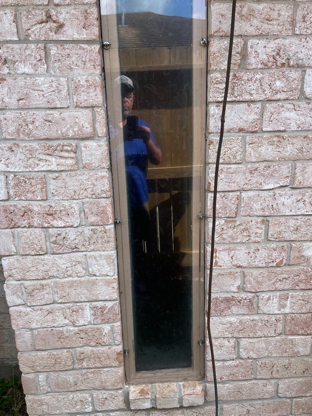 Colored Vinyl Windows to blend into brick by Bayfront Roofing and Construction