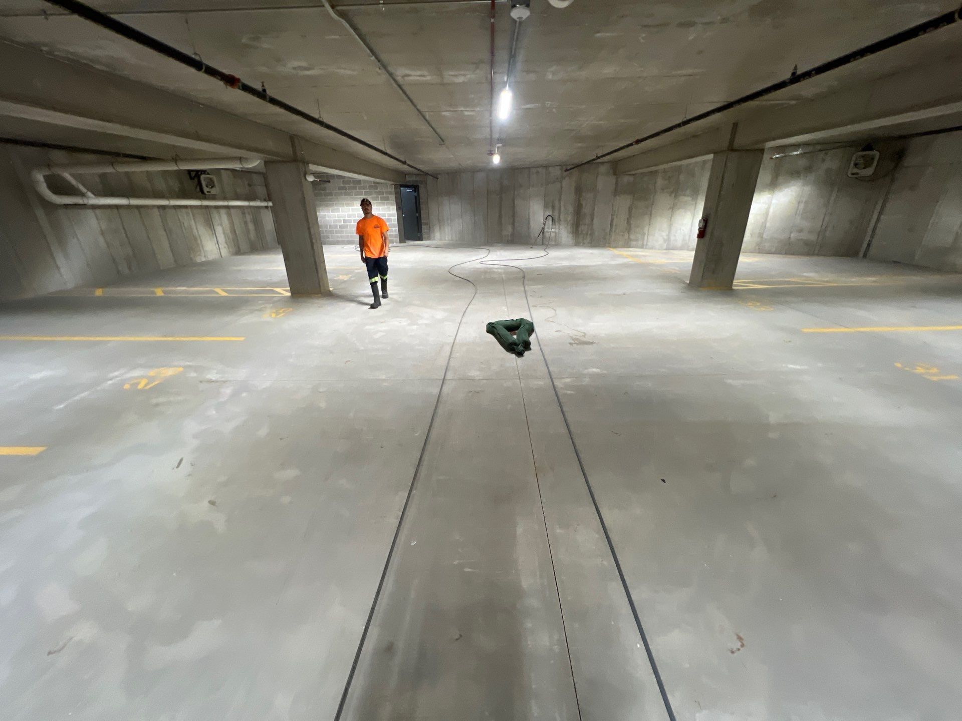 Parking garage using Hot water by Northern Power Washing LLC.
