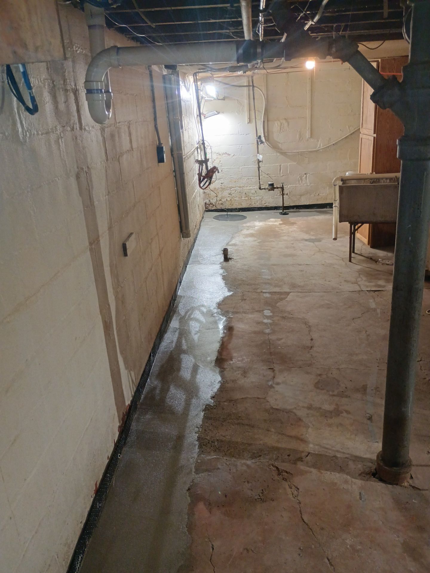 Interior Drain Tile & Sump Pump System in North Minneapolis by Waterproofing Northeast