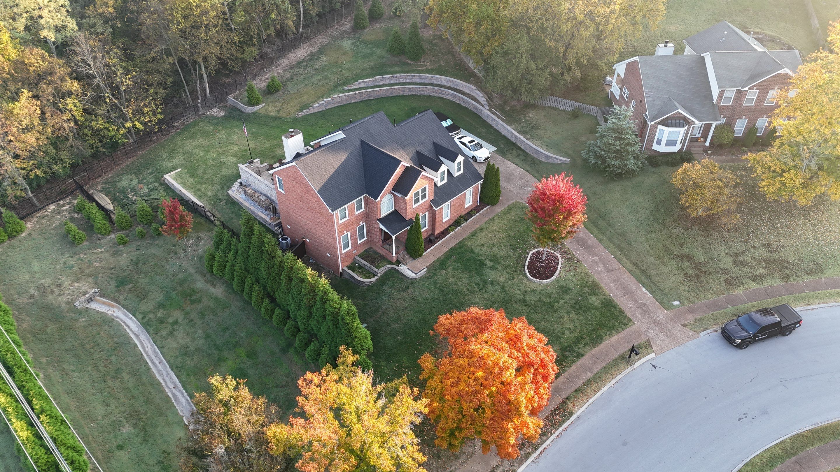 Charcoal Black Re-Roof & Gutters by Royal House LLC