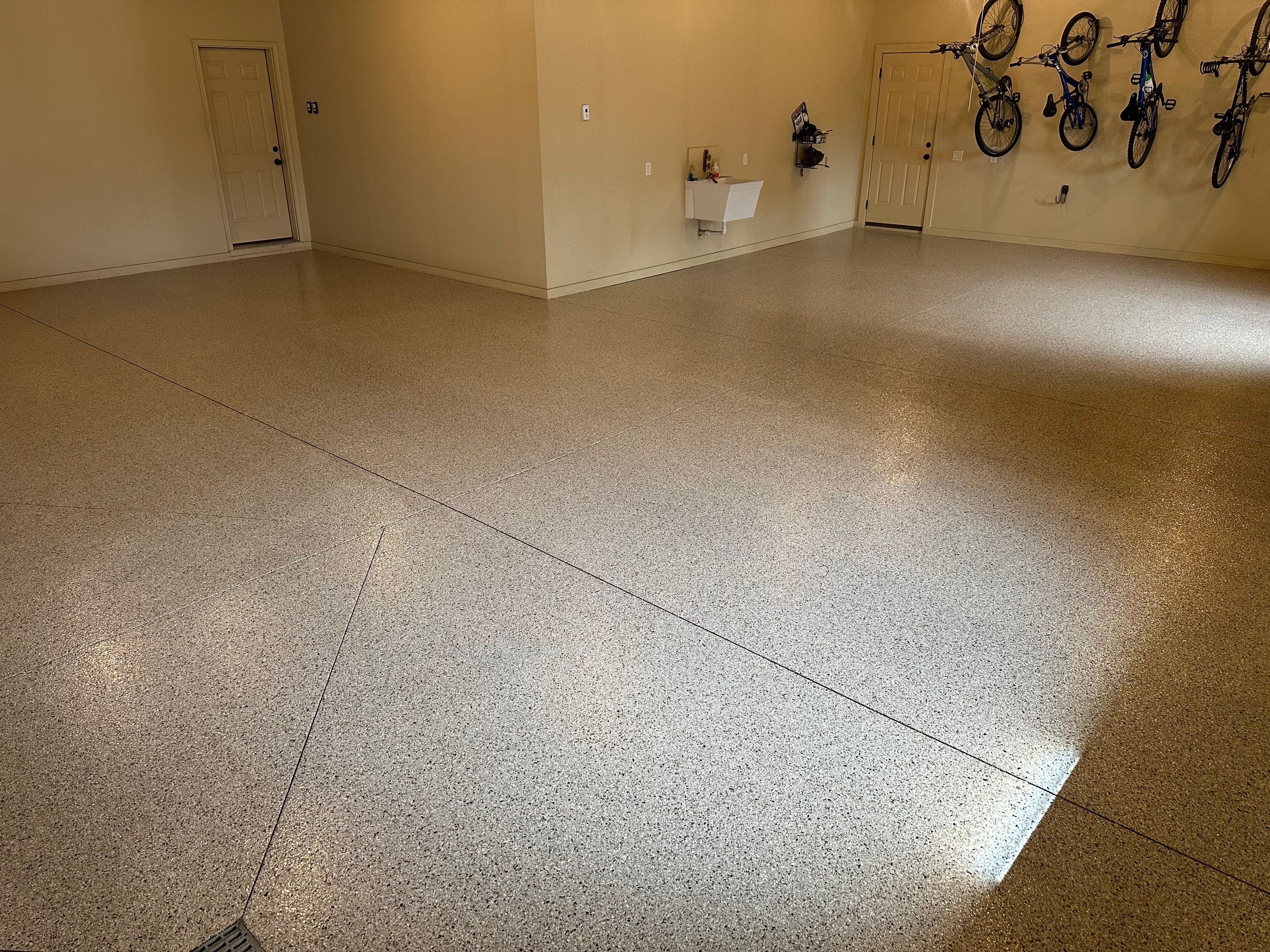 Sioux Falls Garage Floor Concrete Coating with Shoreline Flake Finish by Select Painting, Coatings & Garage Cabinets