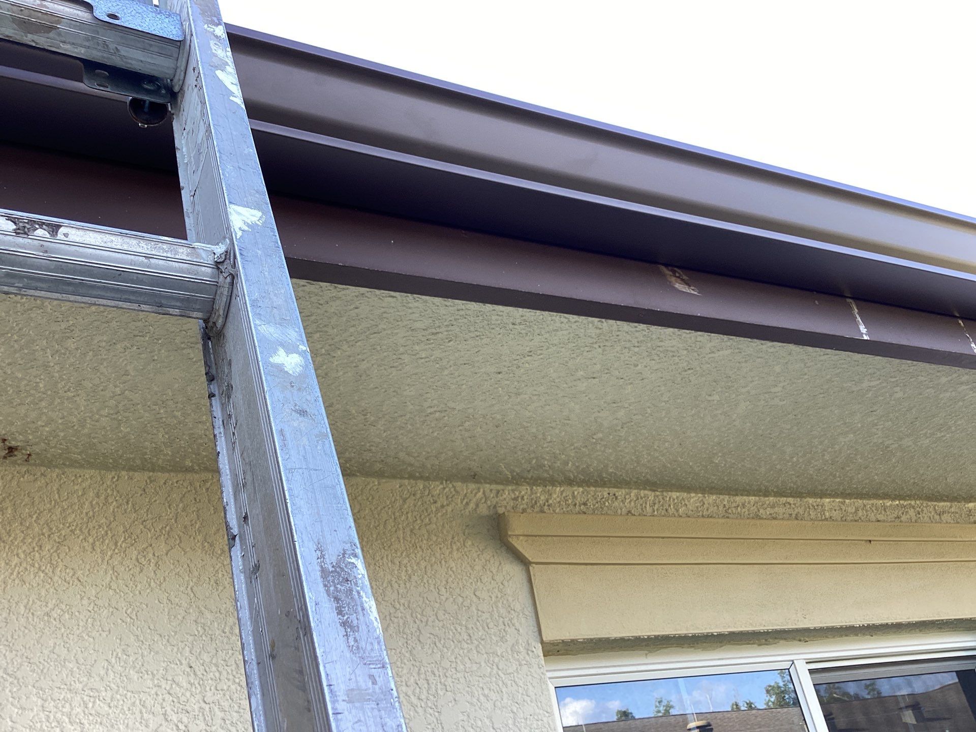 Musket Brown Seamless Gutters using Musket Brown Seamless Gutters in Capen Coral FL by Gutter Professors