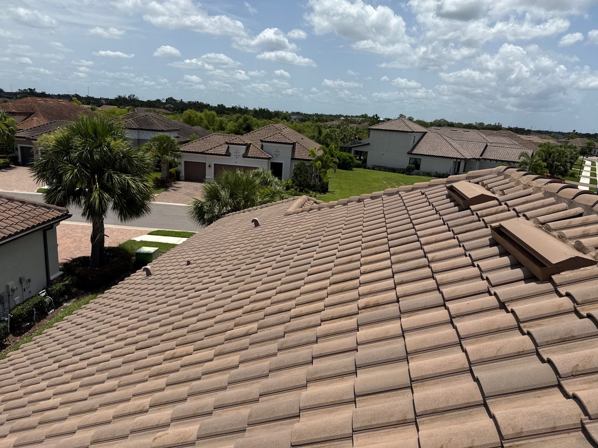 Neighboring Tile Roof Cleaning with Gutter Runoff Control – Palmetto, FL by Sunshine AquaWash