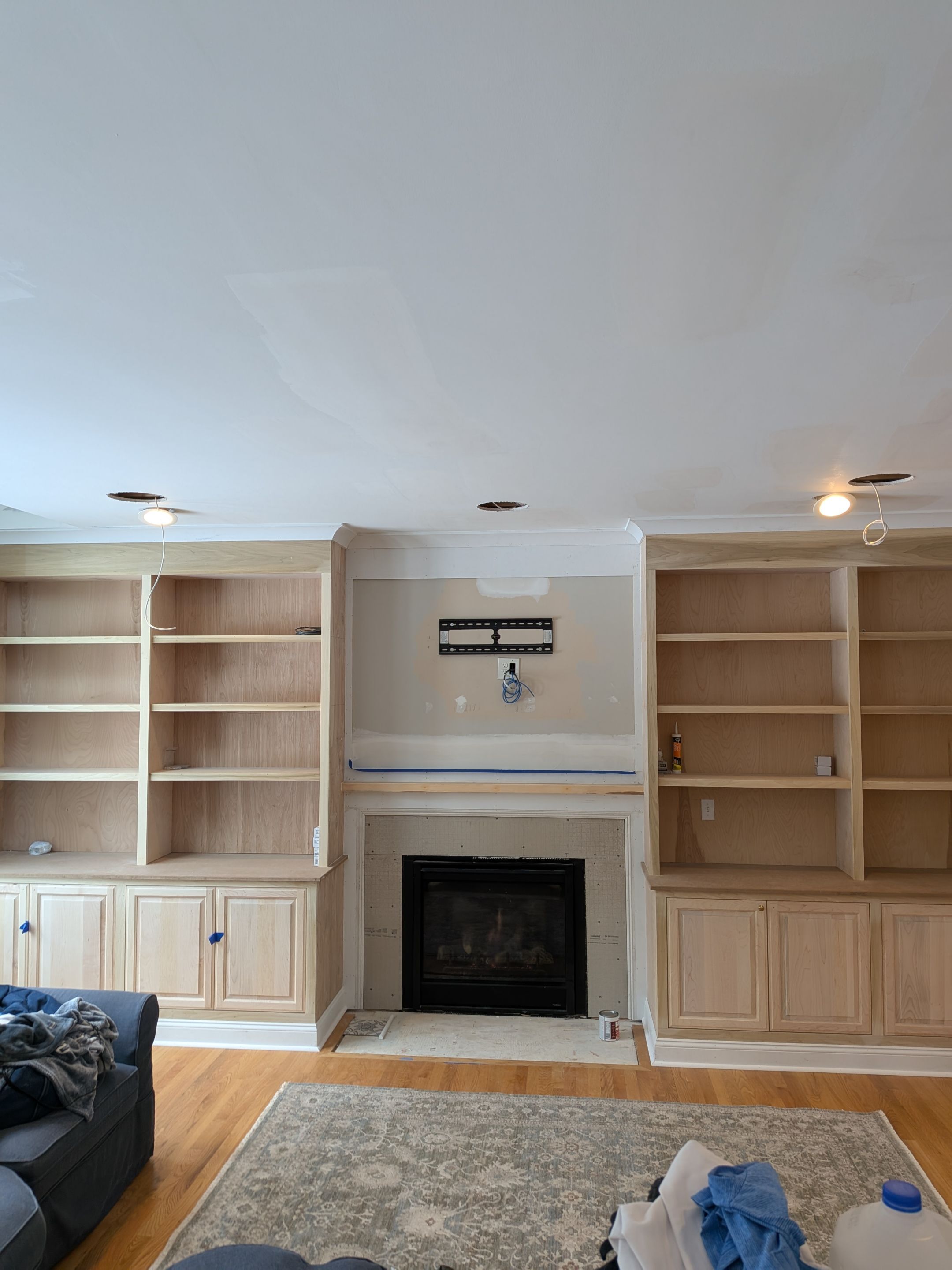 Custom Built-In Cabinetry with Bookshelves by Dennis Moffitt Painting