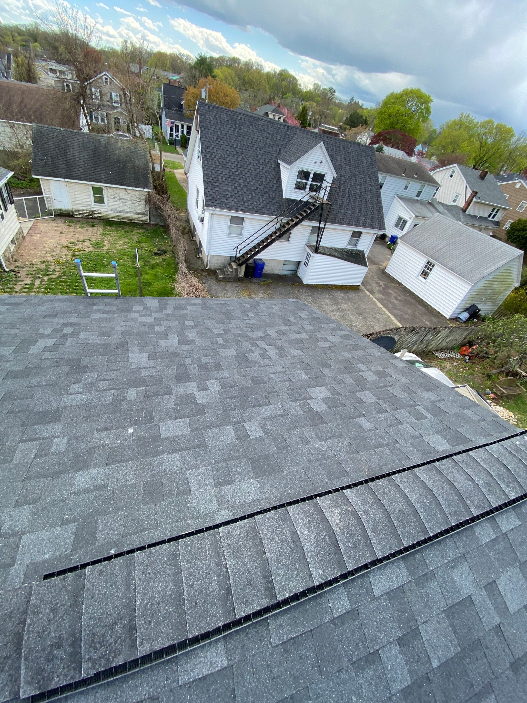 Charcoal Shingles by Reimagine Roofing