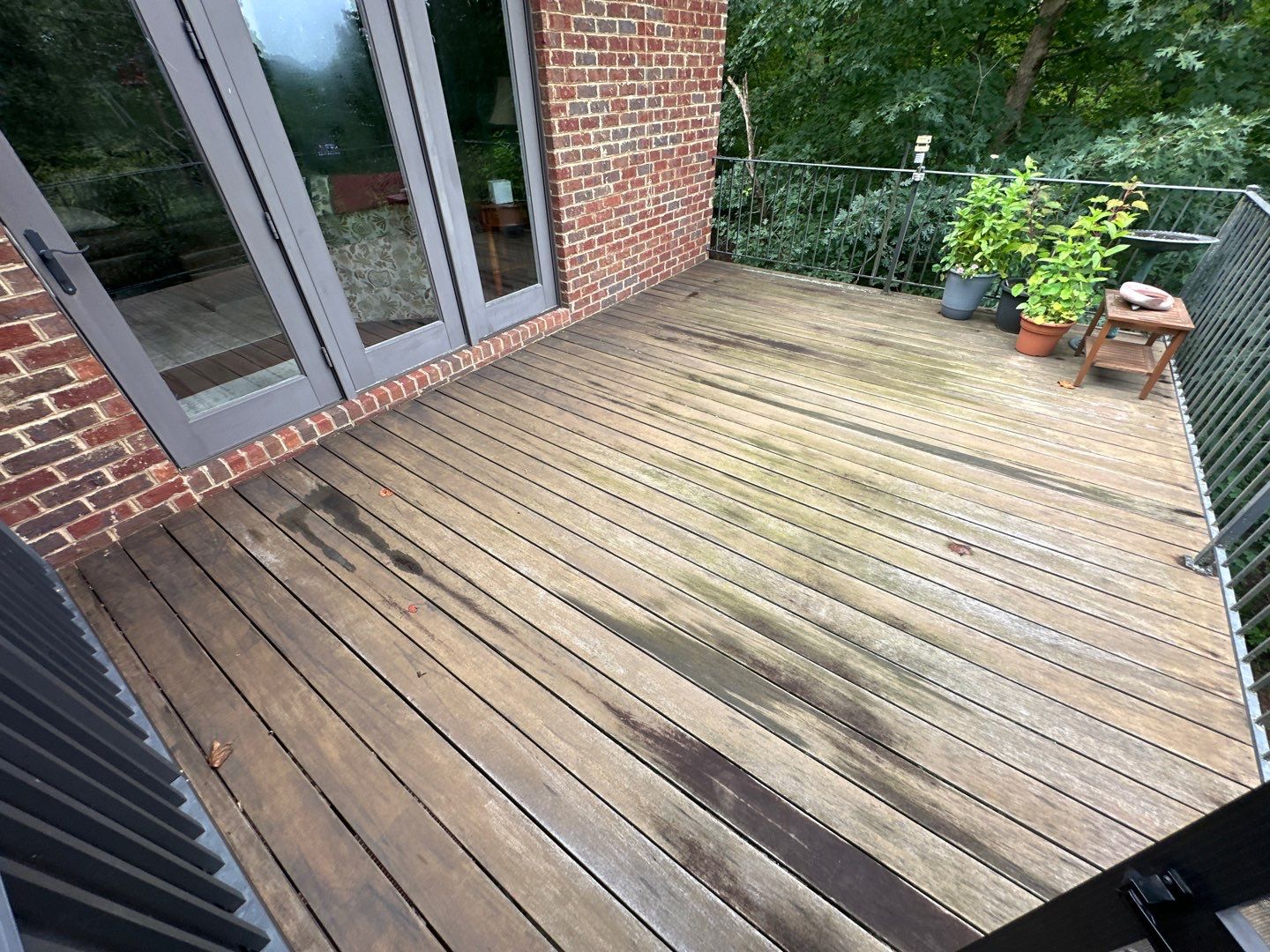 Wood Deck Refinishing and Black Metal Railing Upgrade in Travelers Rest by Painter1