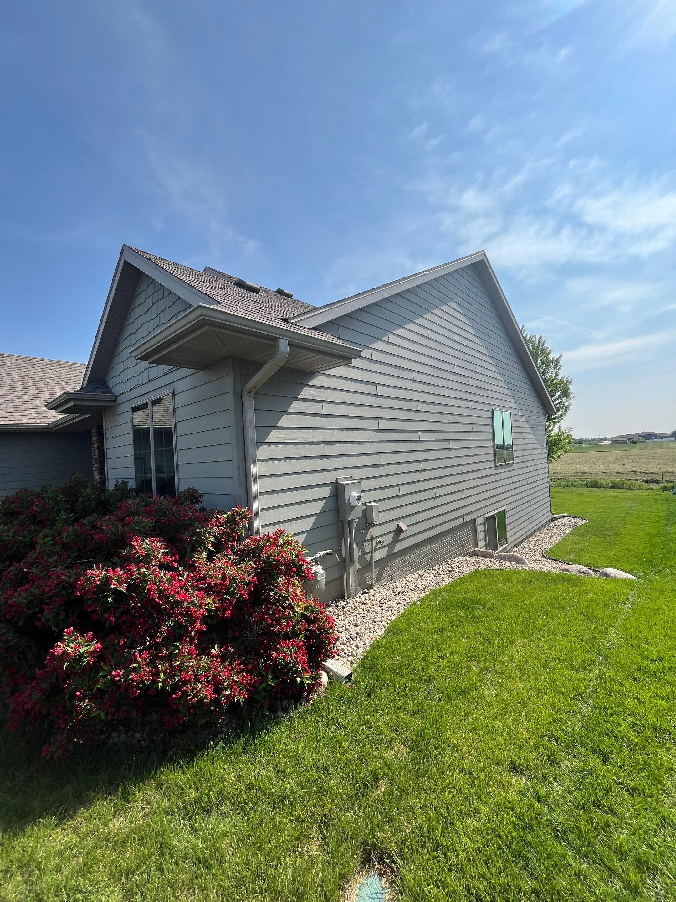 Sioux Falls Residential Exterior Refresh with Fiber Cement Siding by Select Painting, Coatings & Garage Cabinets