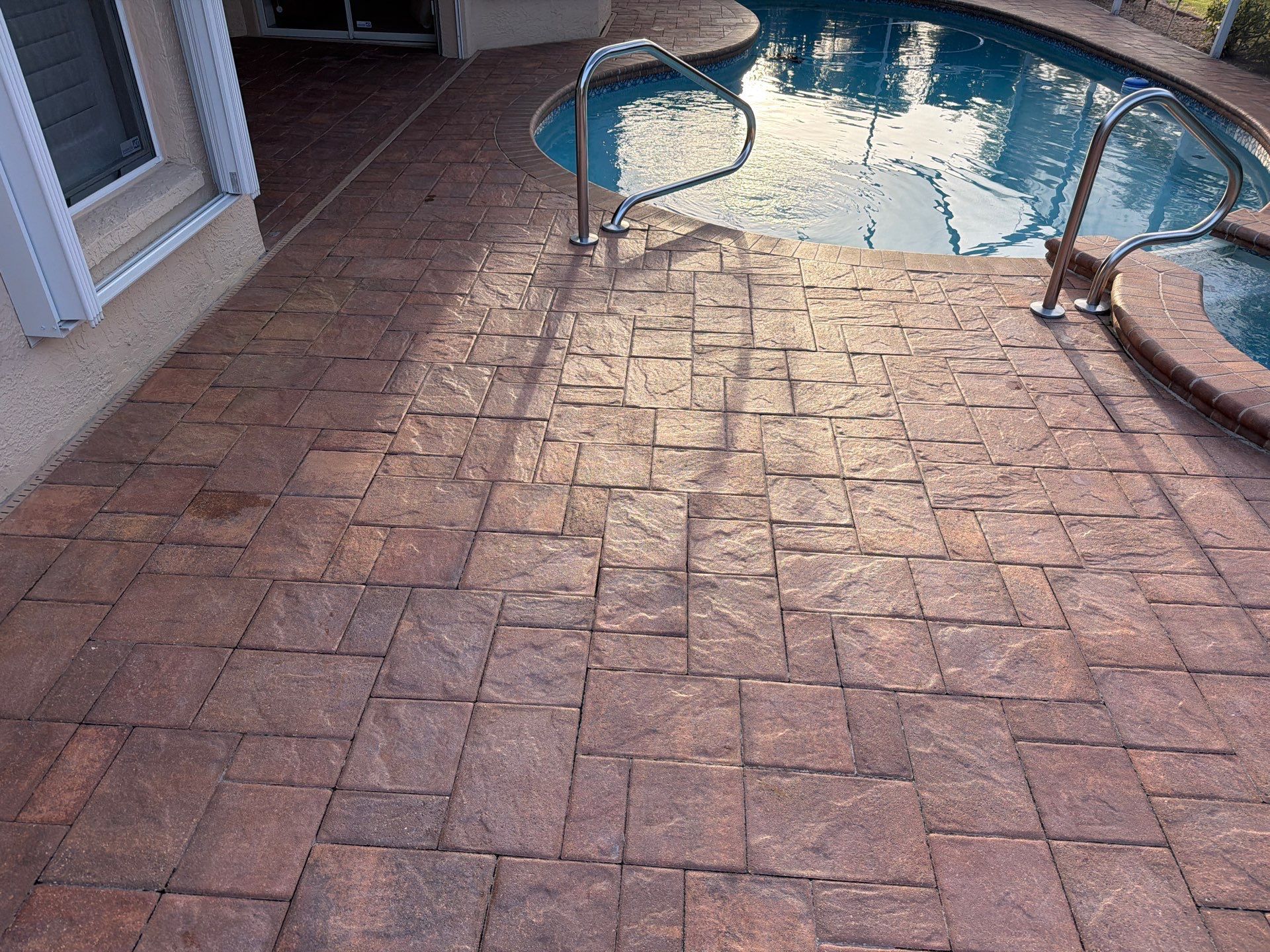 Paver Sealing and Striping for Sun City Center Pool Deck by Supreme Paver Experts