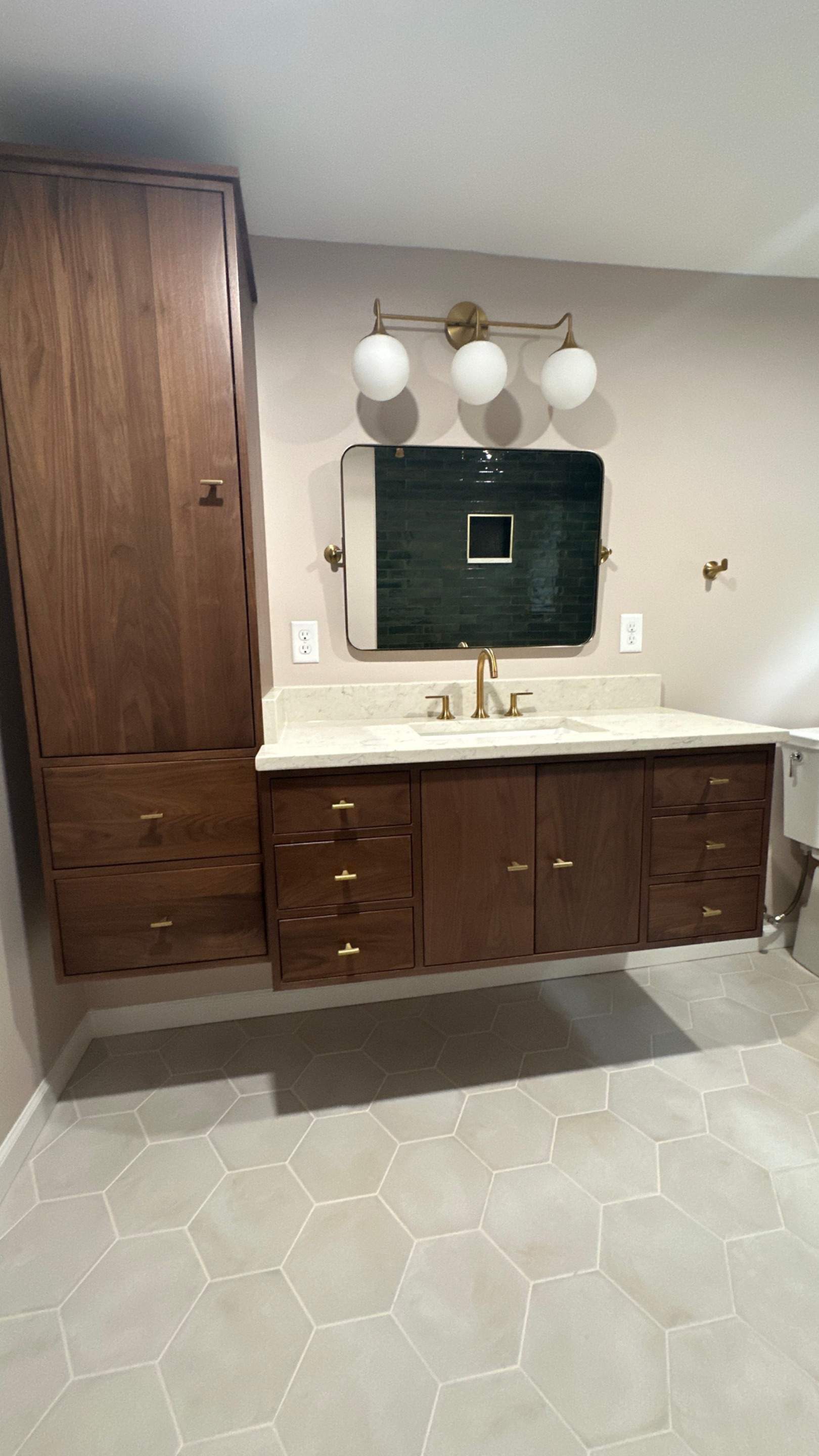 Brandt Double Bathroom Remodels by Integrity Tile and Home LLC