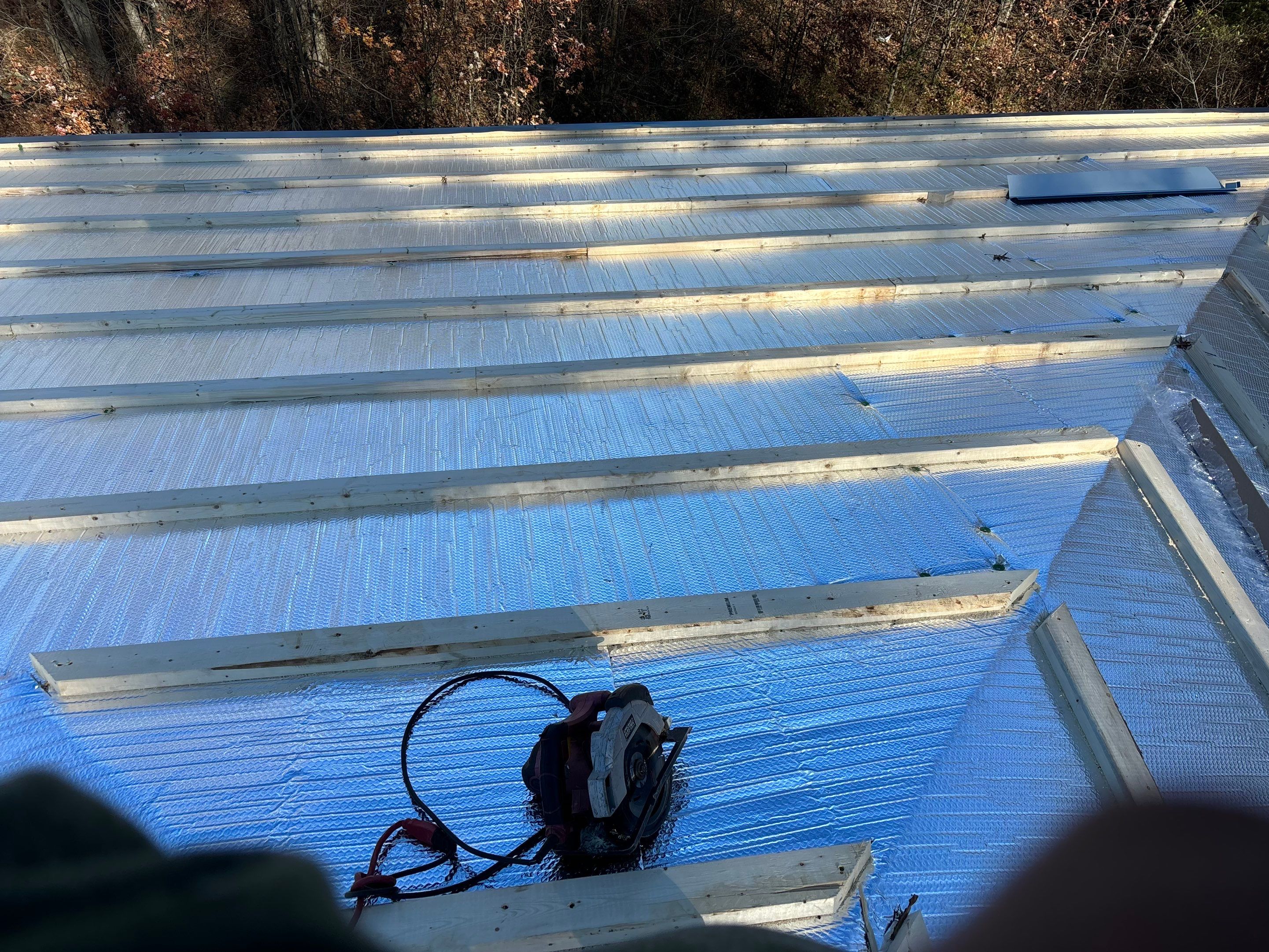 Residential Roofing Installation using Custom Metal and insulation by Storm Contracting 