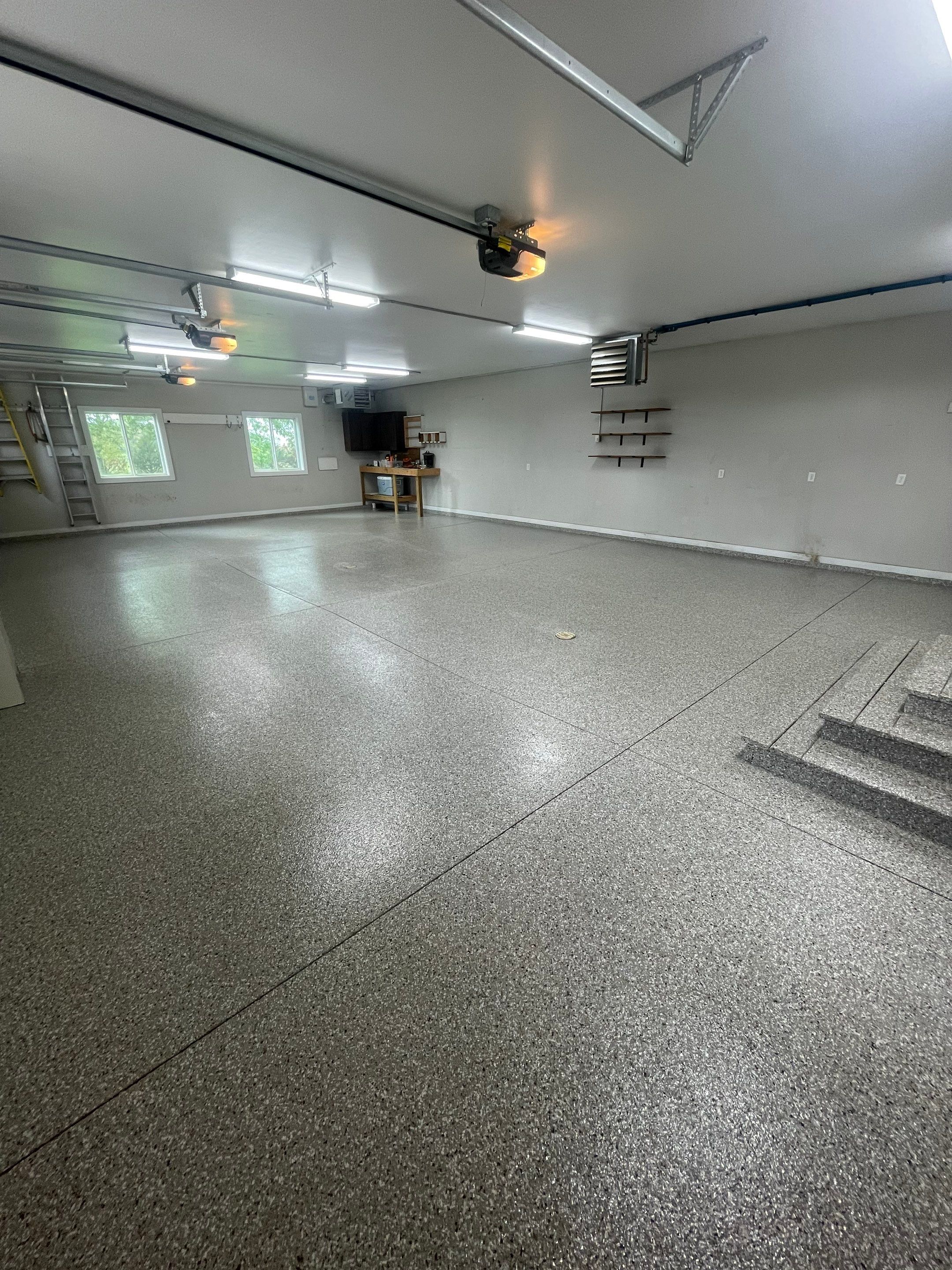 Grey Speckled Polyuera Garage Floor Coating for Hartford Three-Car Garage by Select Painting, Coatings & Garage Cabinets