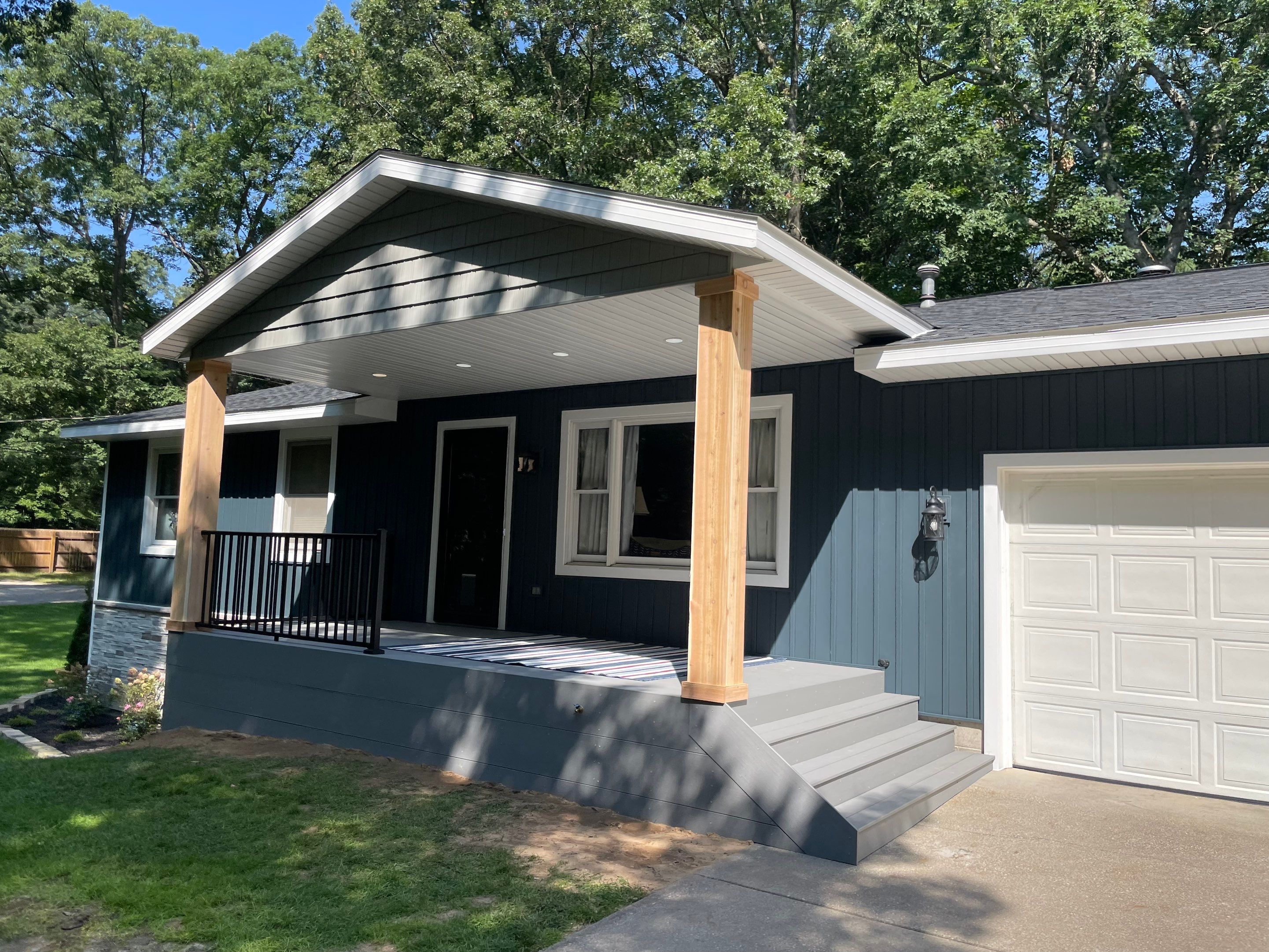 Siding, Deck and Versetta Stone by Avalon Roofing and Exteriors