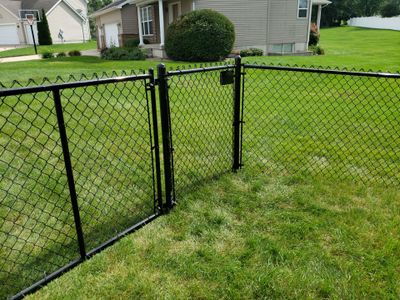 Black Vinyl-Coated Chain Link Fence Installation in Cedar Falls