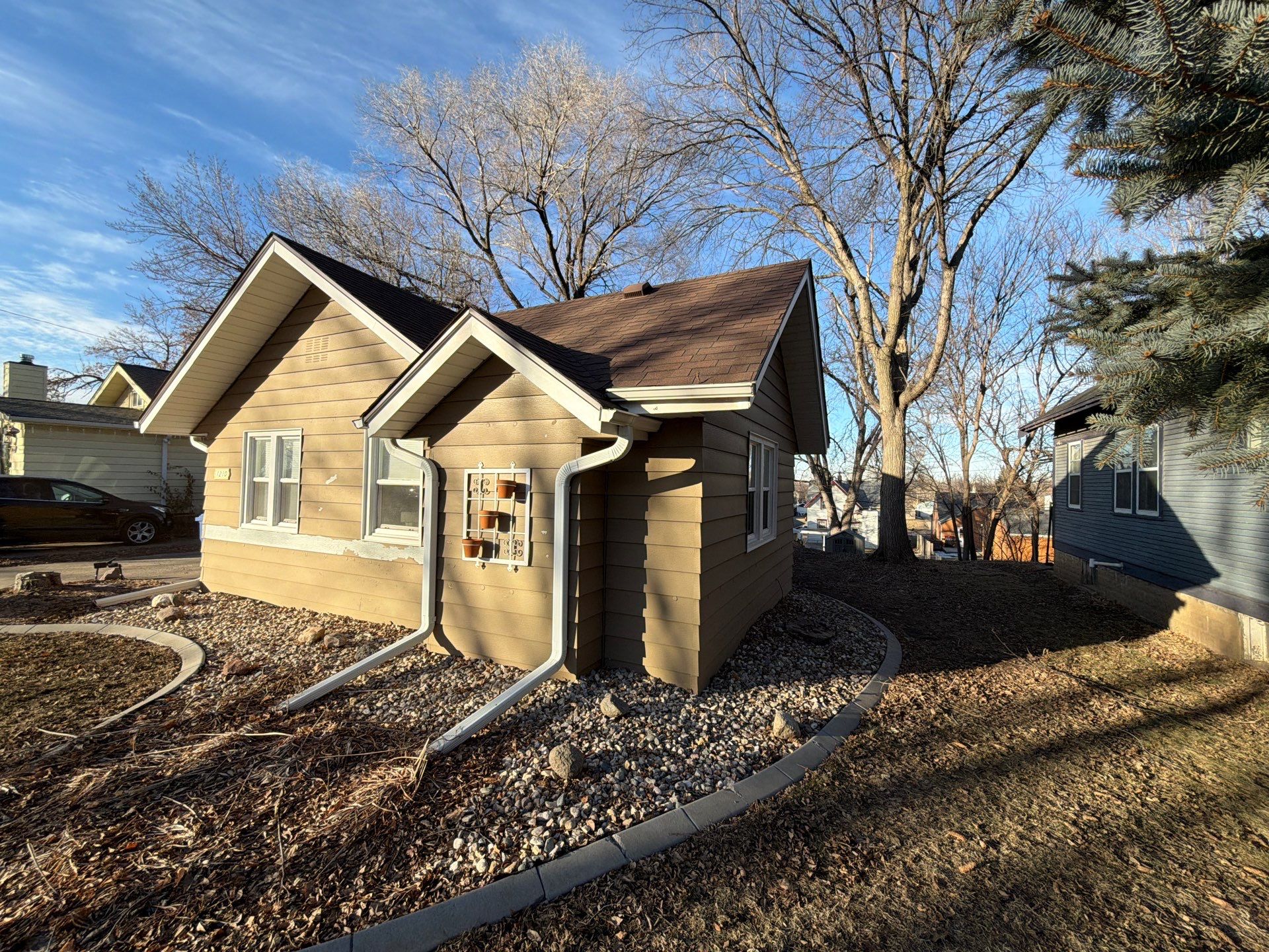 Exterior Siding Repair and Full House Repaint in Sioux Falls by Select Painting, Coatings & Garage Cabinets