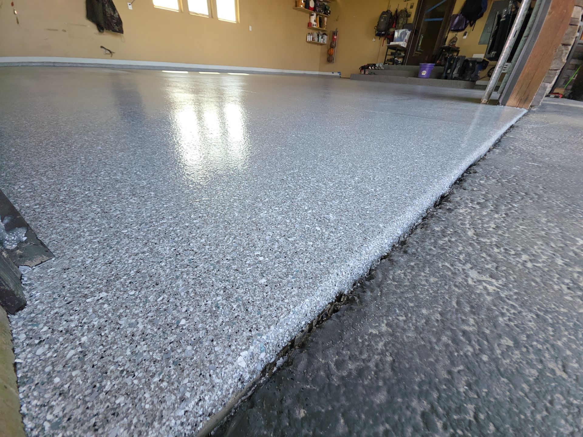 Turquoise Hybrid Polyaspartic Garage Floor Coating in Sandpoint by Croc Coatings, LLC