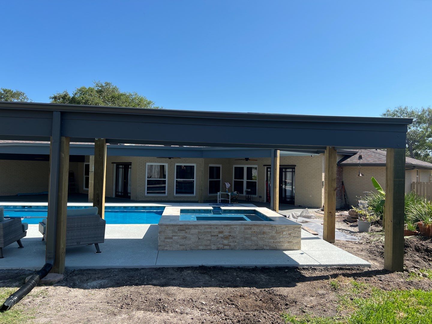 Beautiful pool side build by Bayfront Roofing and Construction