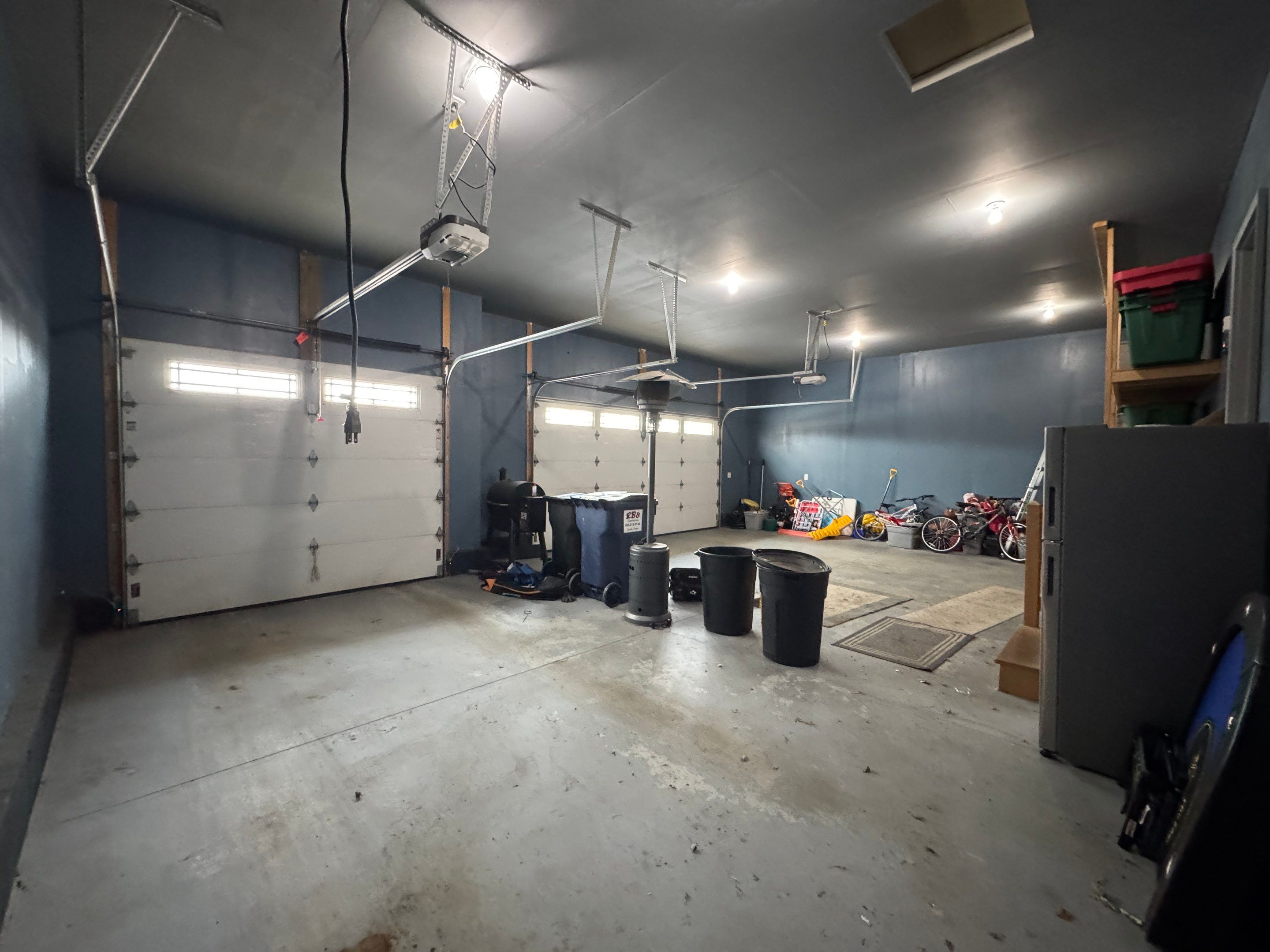 Grey Speckled Epoxy Garage Floor and Stair Coating in Sioux Falls by Select Painting, Coatings & Garage Cabinets