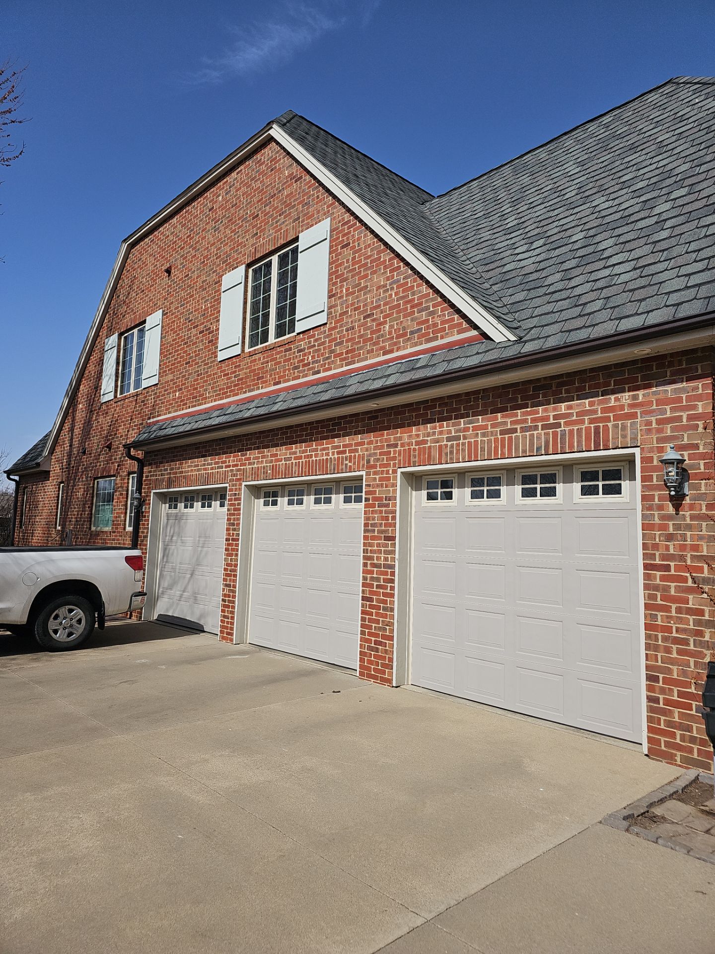 Residential Exterior Brick Painting and Limewash Refresh in Sioux Falls by Select Painting, Coatings & Garage Cabinets