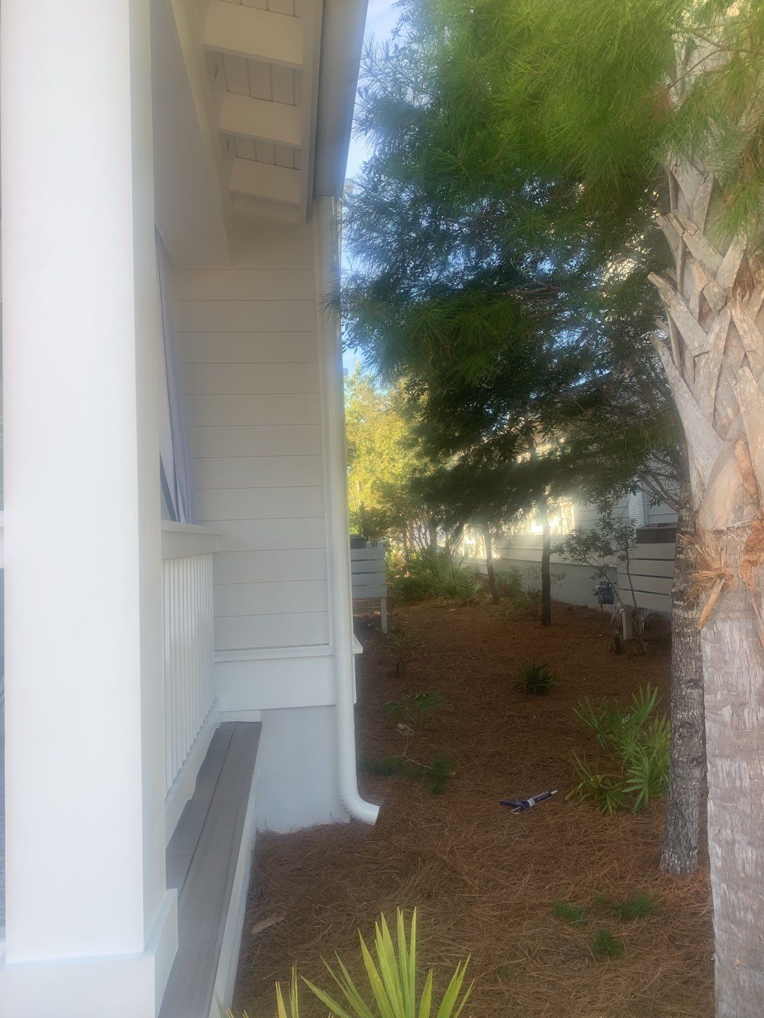 White Half-Round Gutters Installation in Rosemary Beach, FL by Gutter Professors