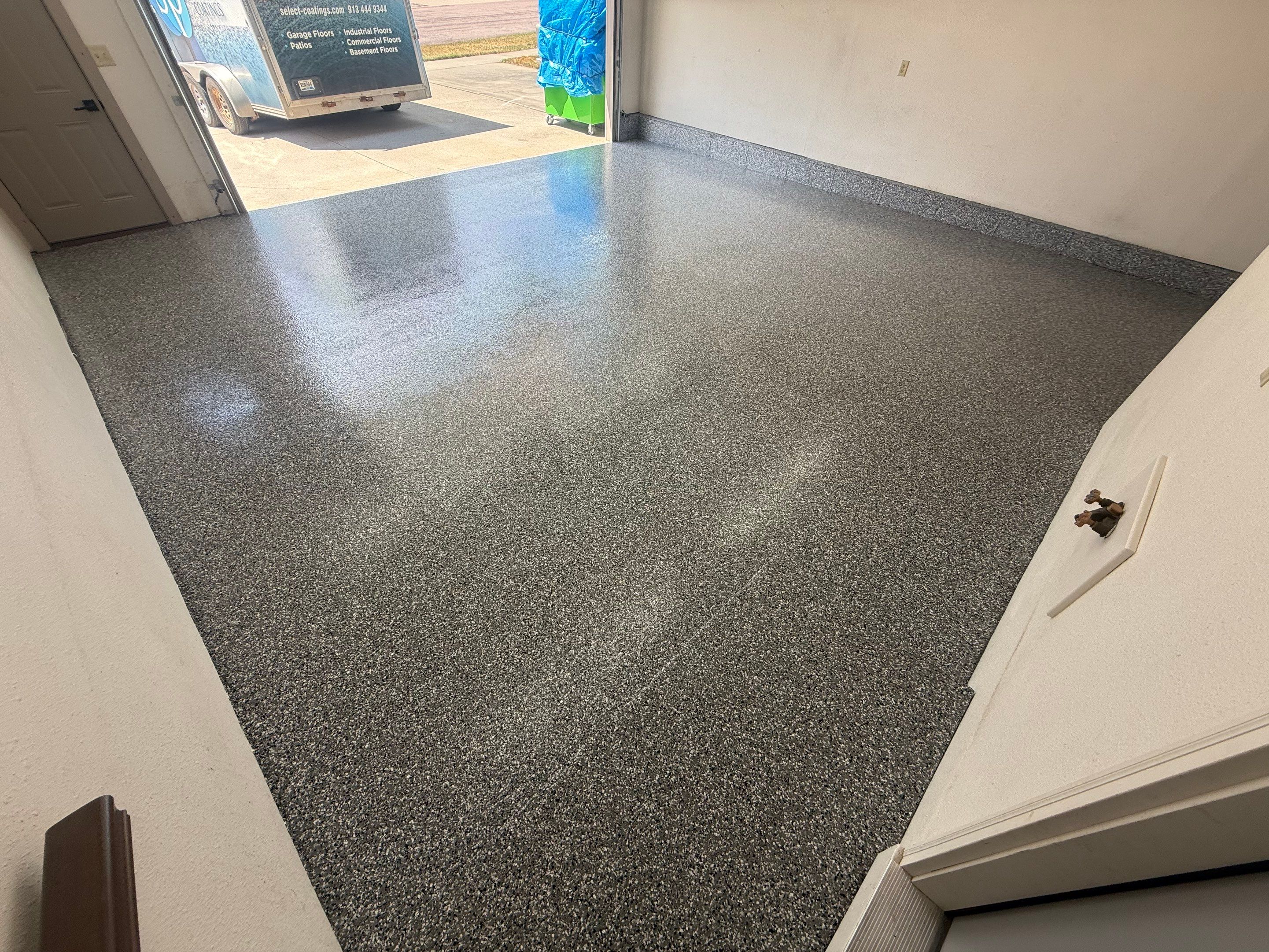 Smoke Flake Garage Floor Coating in Dell Rapids by Select Painting, Coatings & Garage Cabinets