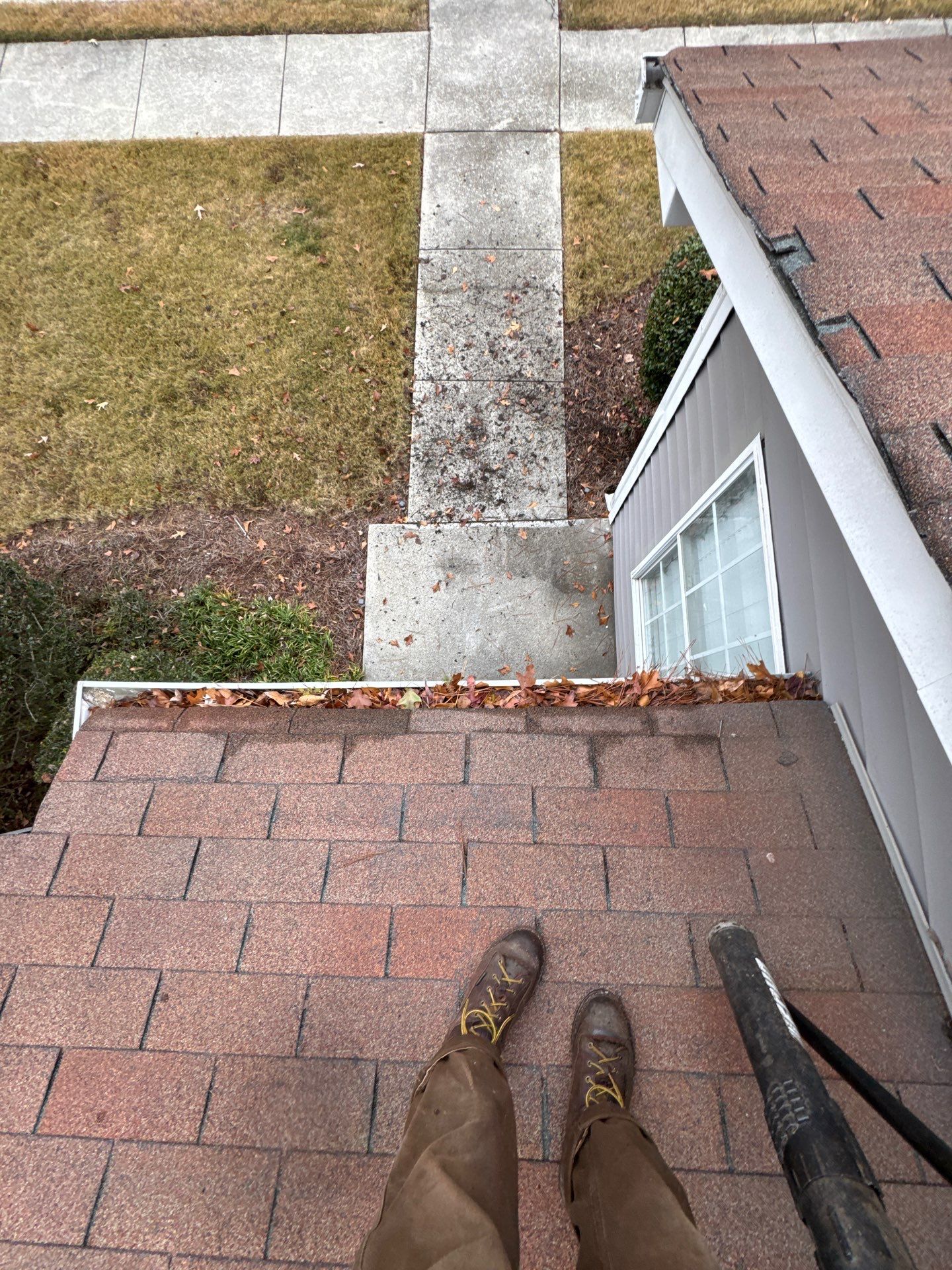 Commercial gutter cleaning Covington & Newton County, GA before photo with filled gutters