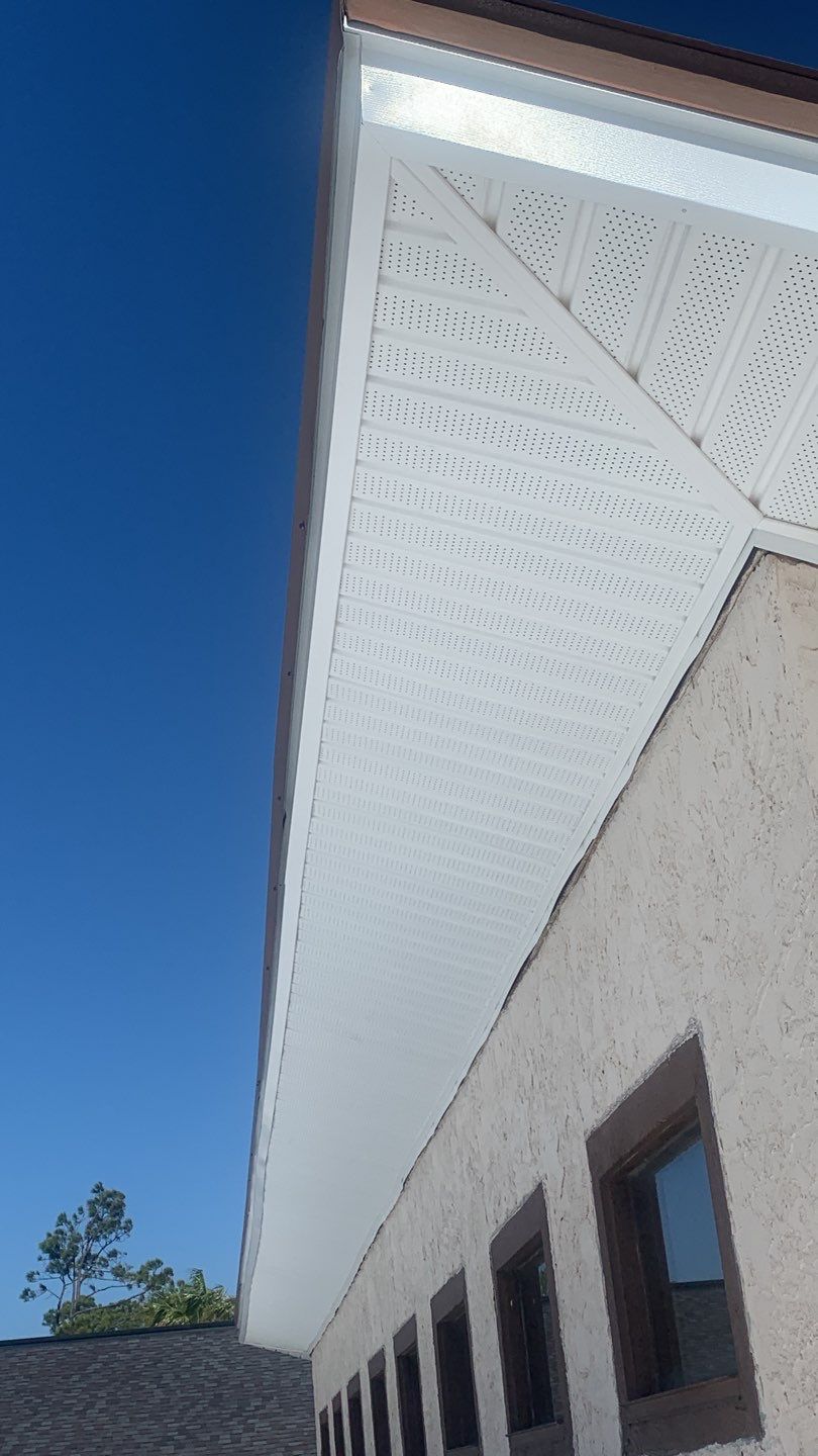 Soffit and Fascia Installation Using White Vinyl Soffit and Musket Brown Fascia by Gutter Professors