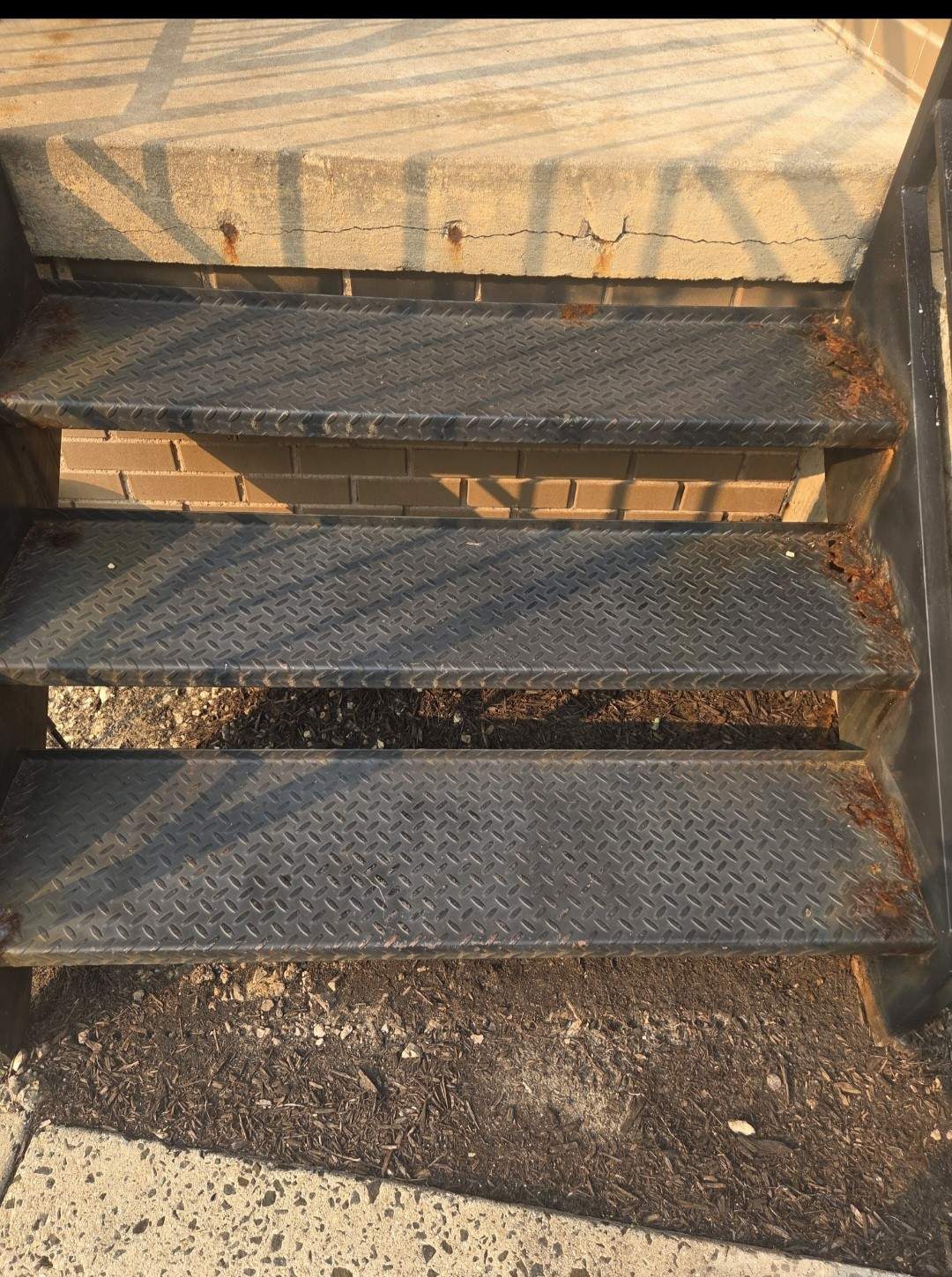 Black Metal Diamond Plate Staircase Restoration in Washington, DC by Capitol Iron Works