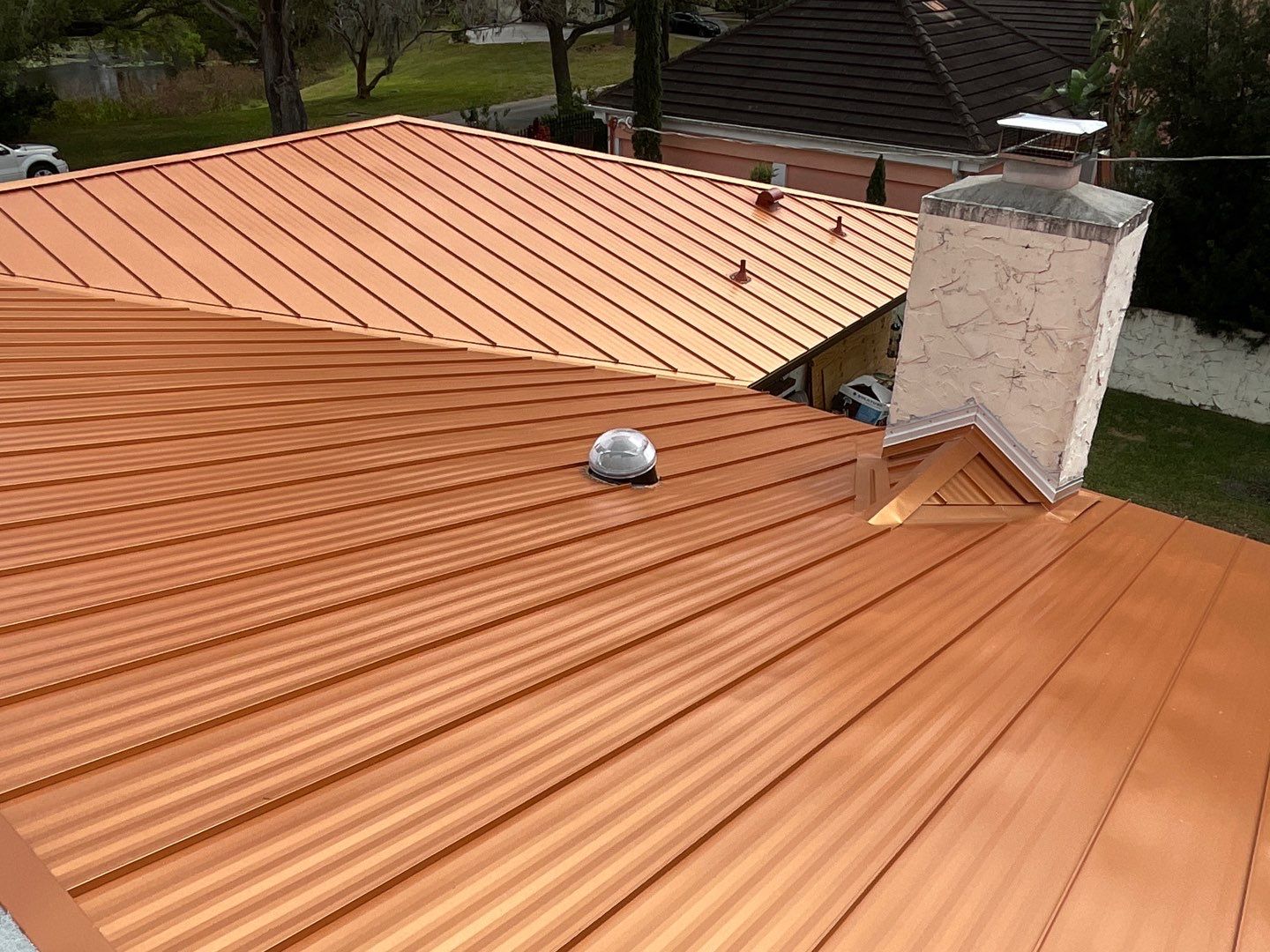 Residential Re-Roof using MS Metals, Copper Penny, Standing Seam. by First Due Roofing