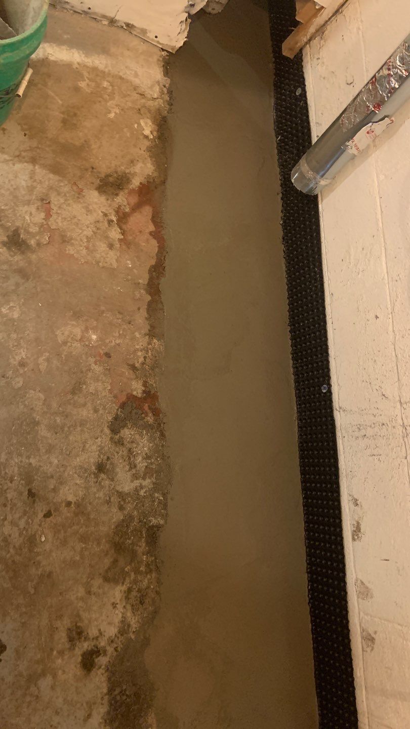 Solving a One-Wall Water Issue in St. Paul by Waterproofing Northeast