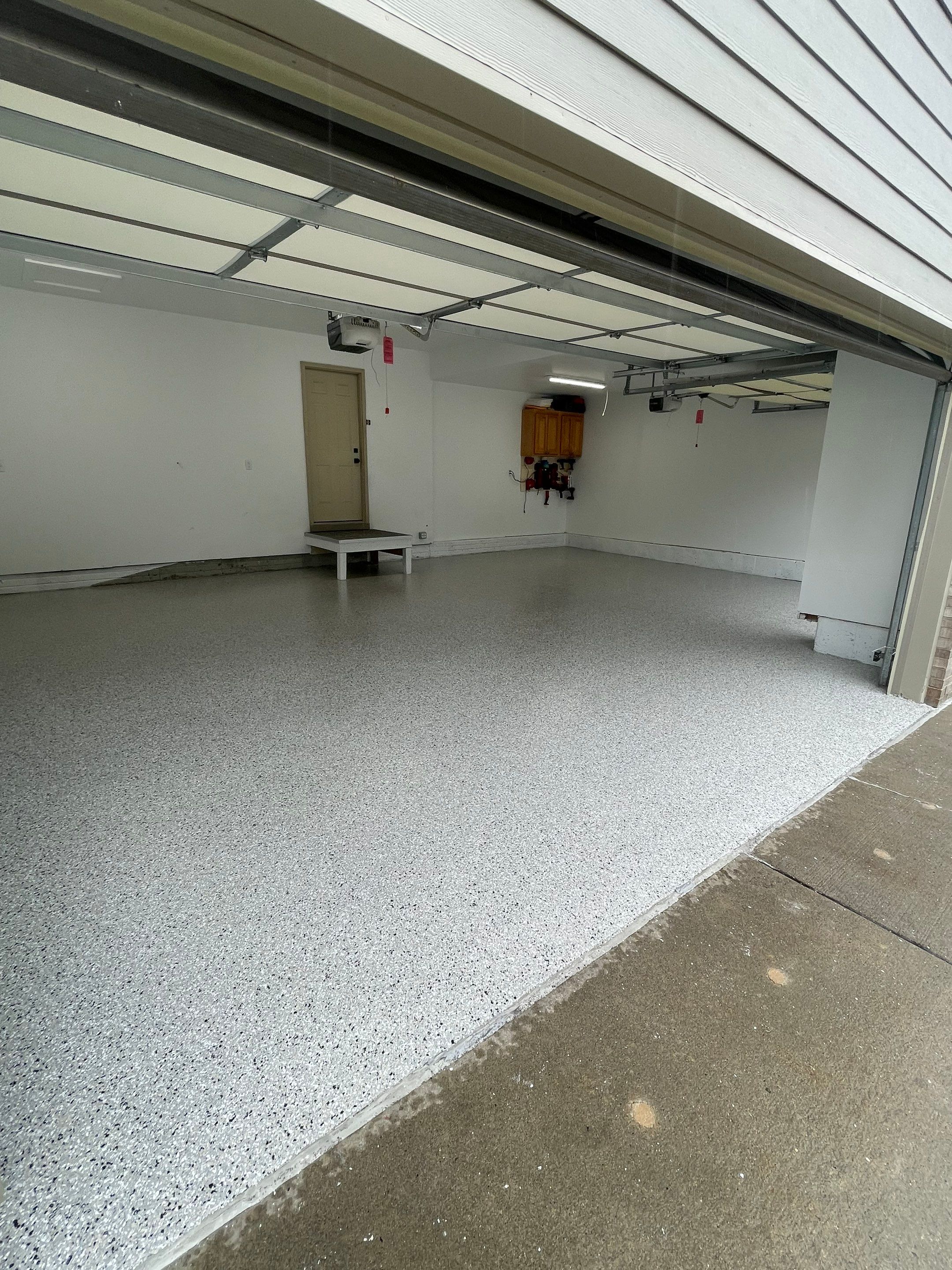 Cabin Fever Garage Floor System in Sioux Falls by Select Painting, Coatings & Garage Cabinets