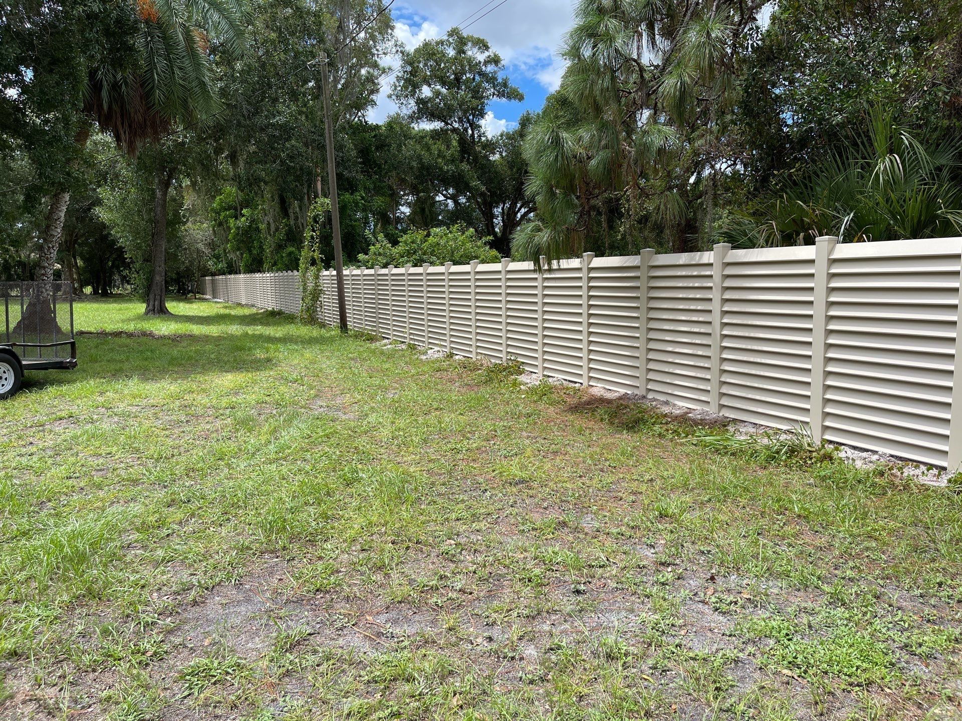 Sarasota, FL. Vinyl Fence Installation using Tan Vinyl Louvered Vinyl Fence by Asap fence and gates, LLC