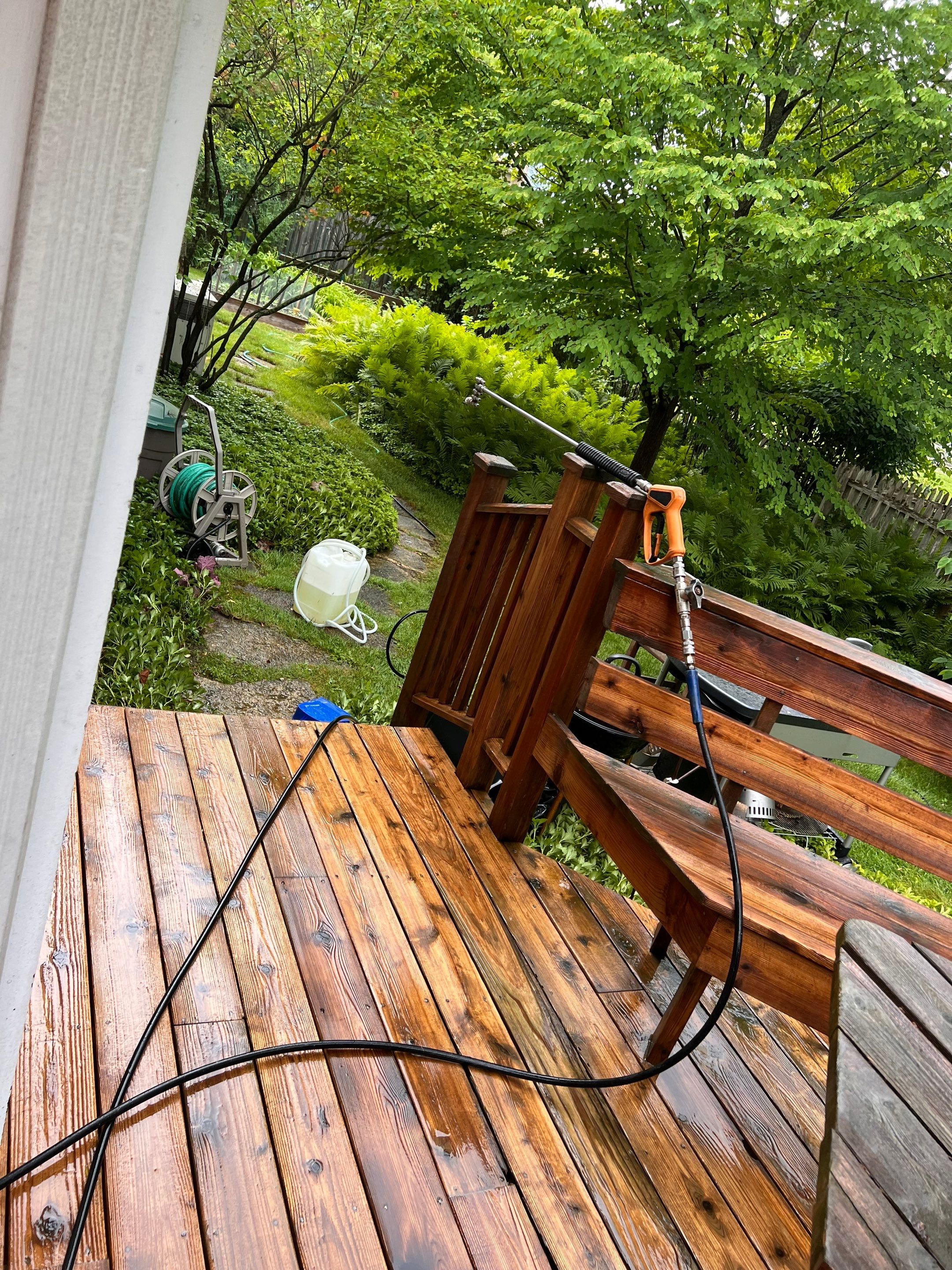 Wood deck cleaning, board replacement and staining by Northern Power Washing LLC.