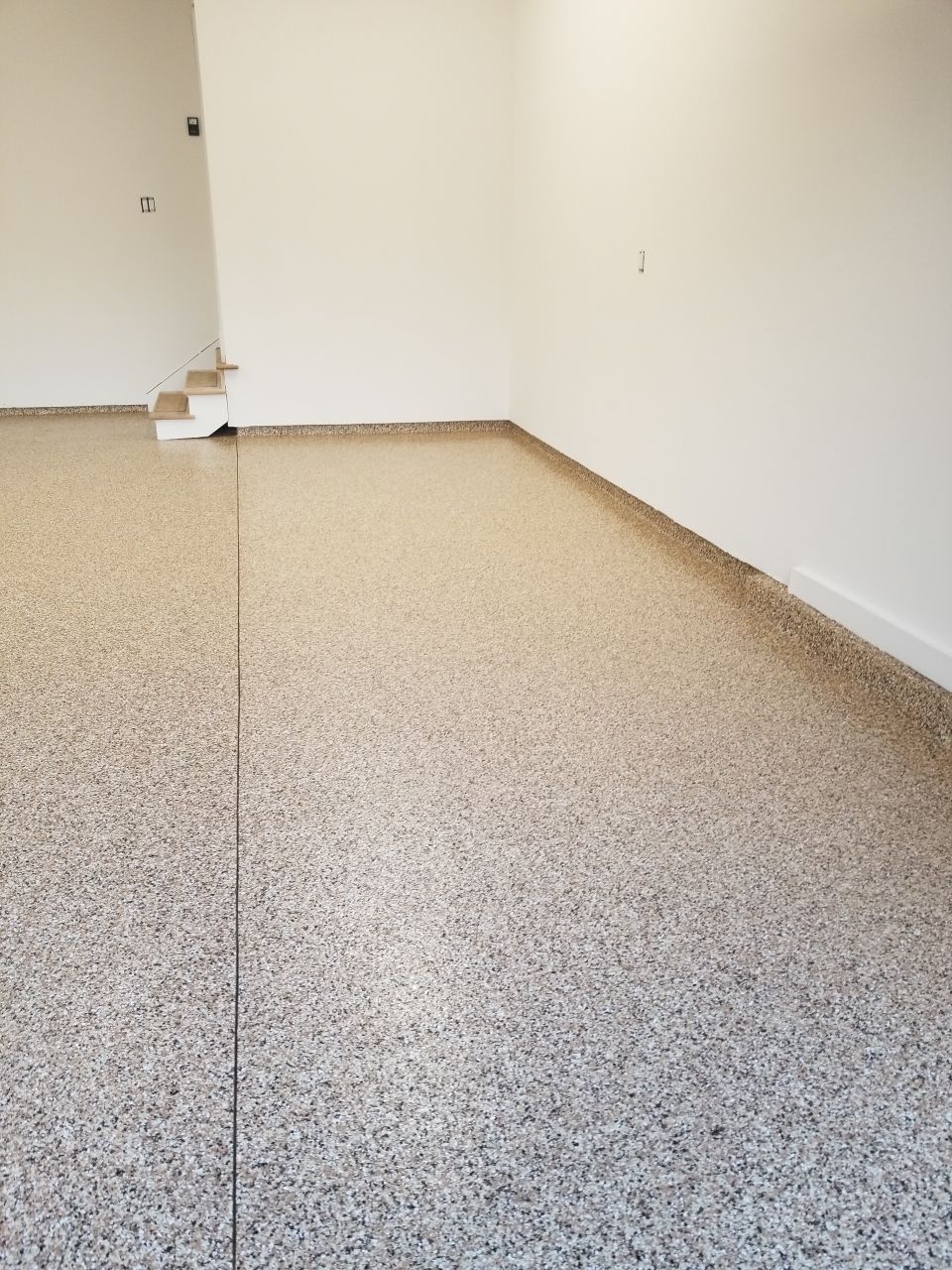 Garage Floor in Sandstone by Spectrum Painting, LLC