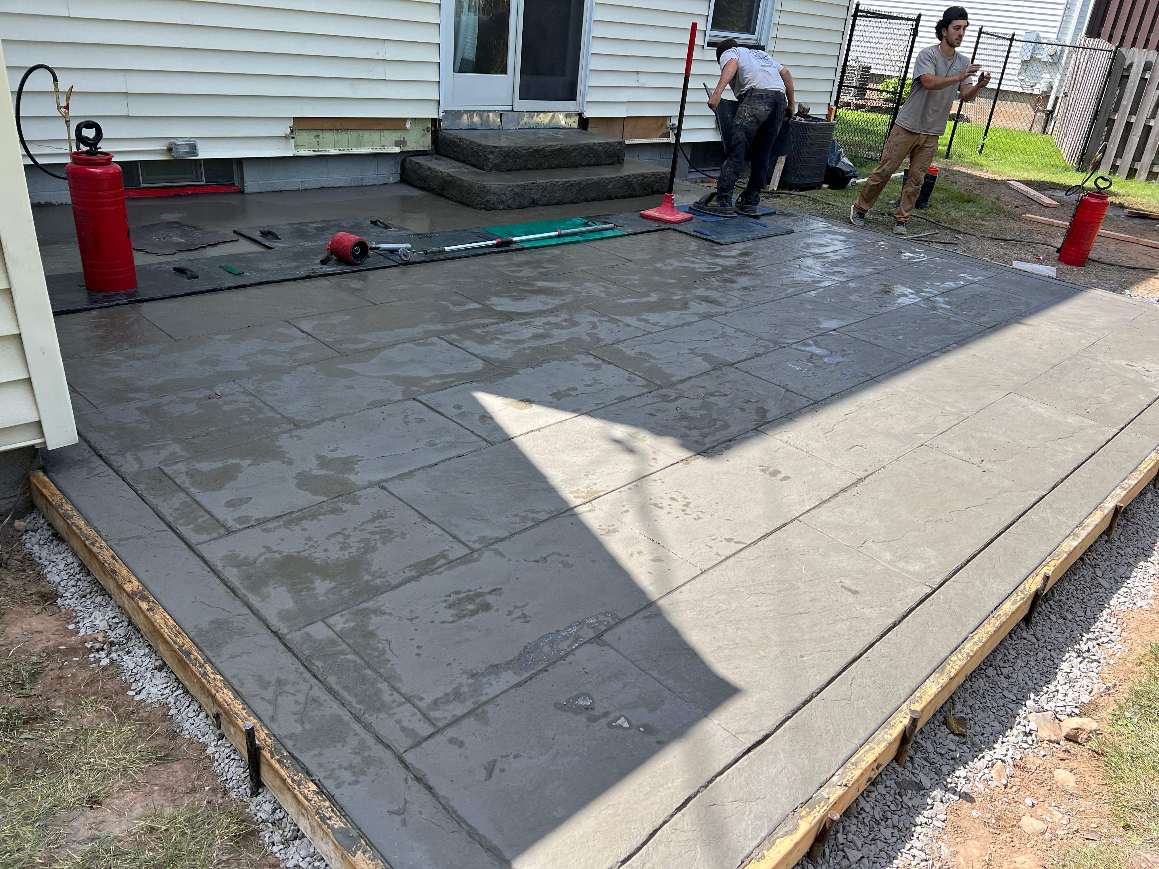York Bluestone stamped patio  by NG Masonry & Construction LLC