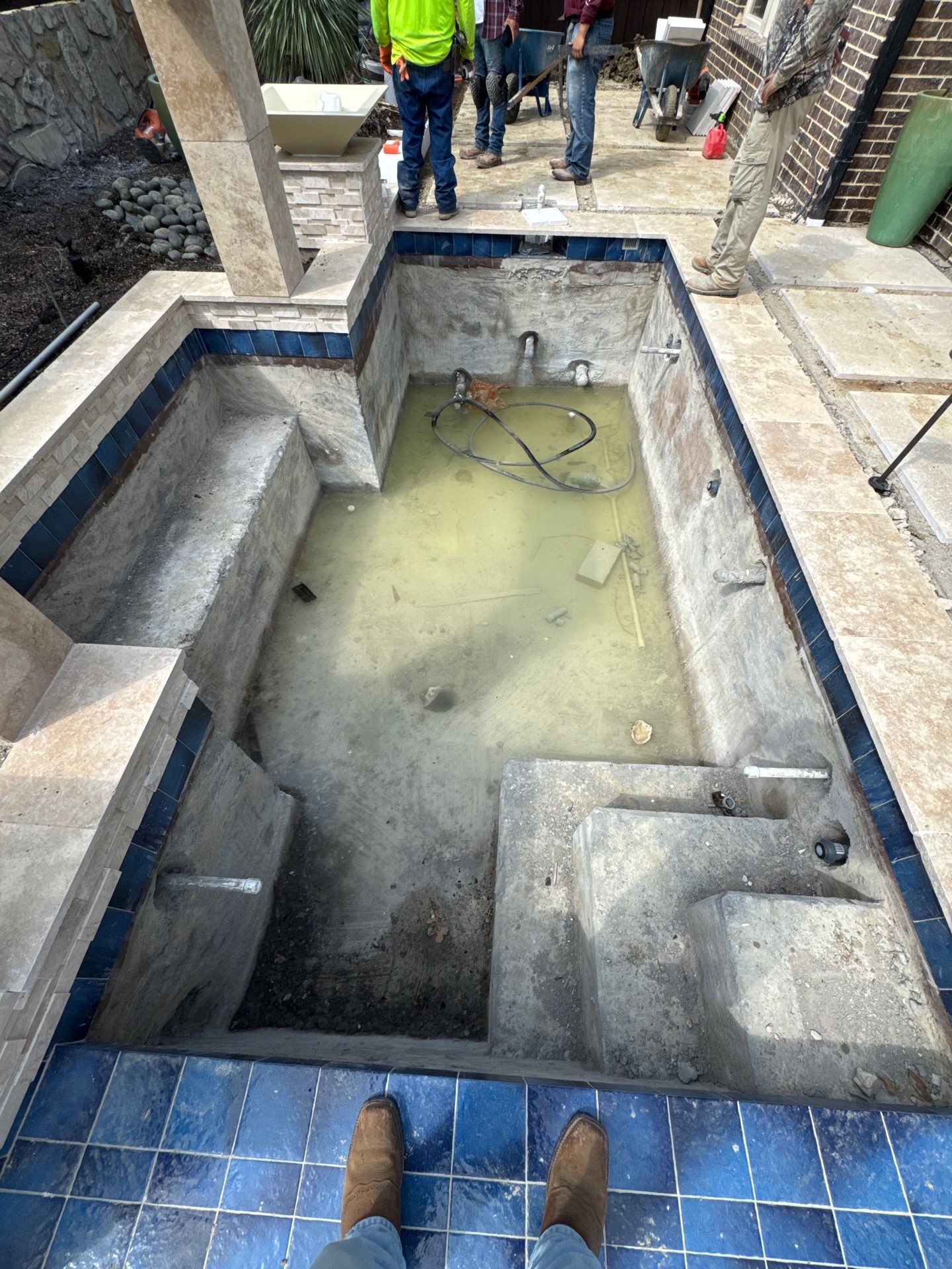 Modern Pool with Raised Water Feature Wall by Pinnacle Pools and Spas - DFW