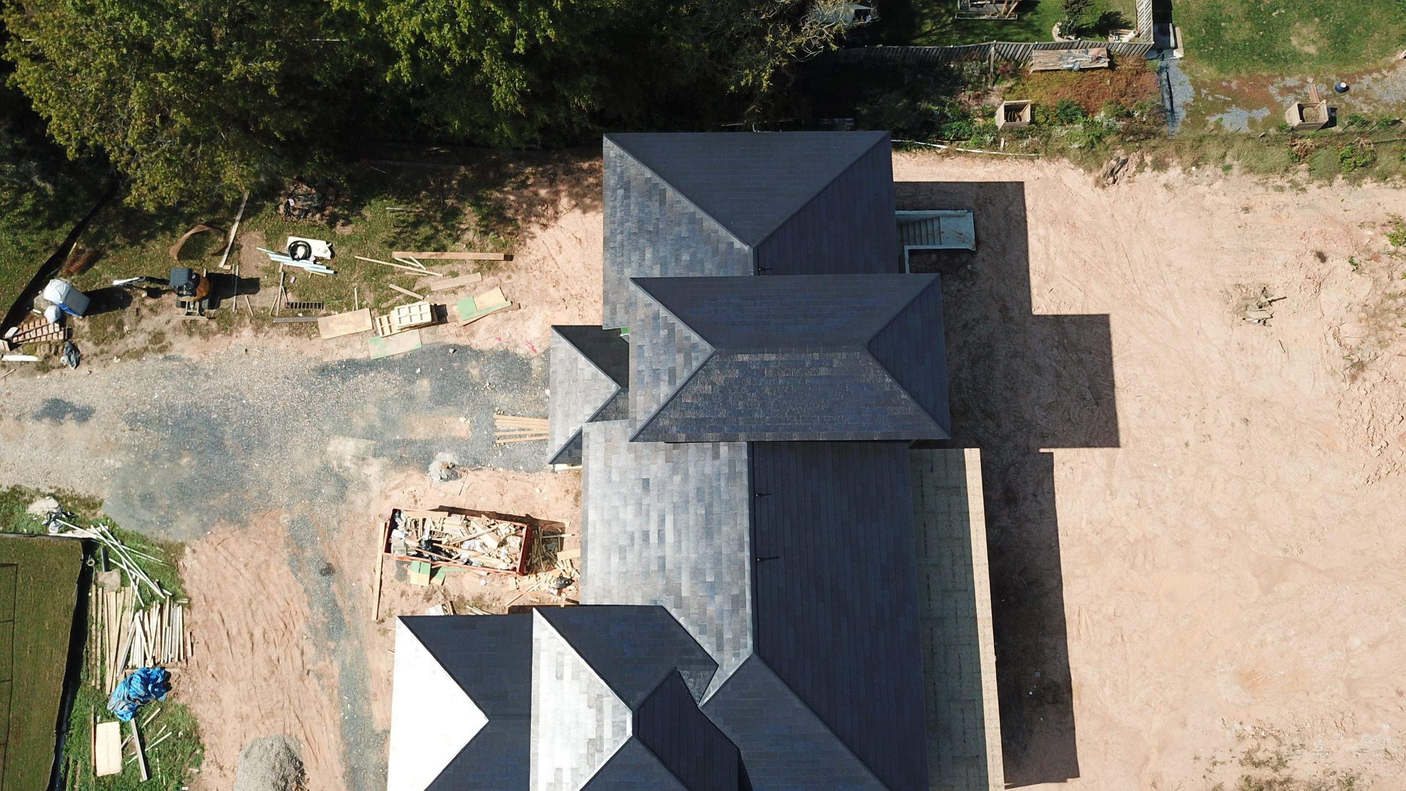 Tesla Solar Roof  using Tesla Solar Roof V3 tiles by American Home Contractors