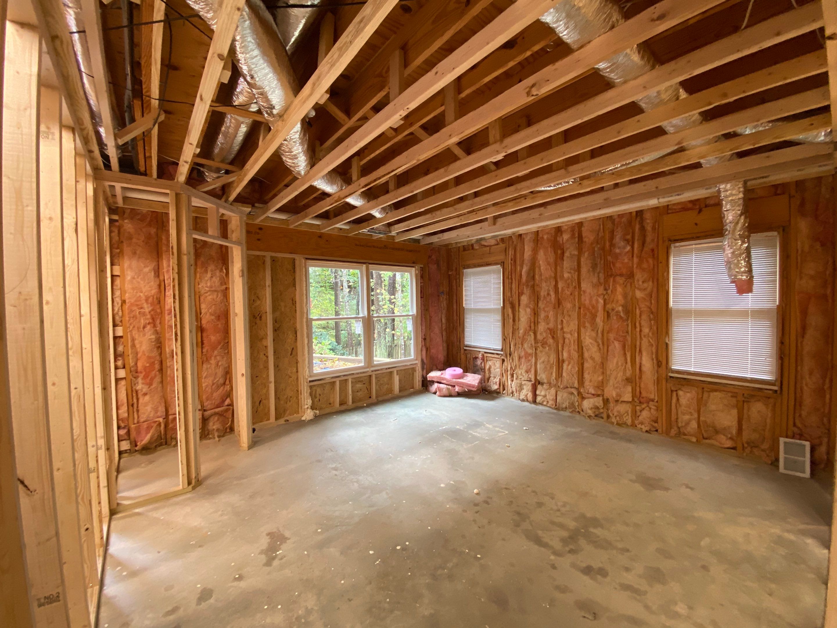 Acworth Basement Transformation With Wet Bar and Stone Fireplace by Swift Home Renovations