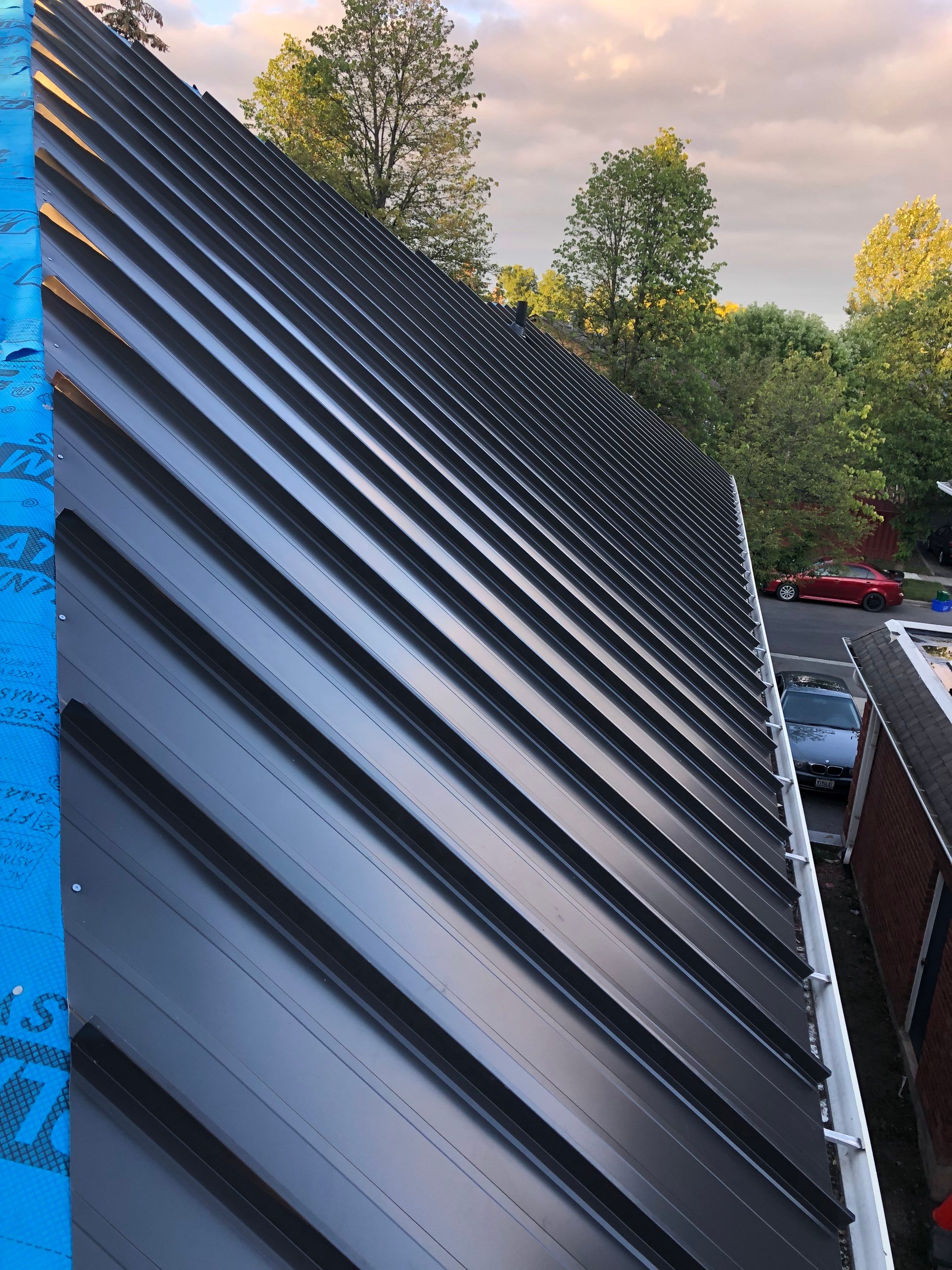 Residential Roofing Installation using 16" Standing Seam Panels by Jay Carter Roofing & Sheet Metal