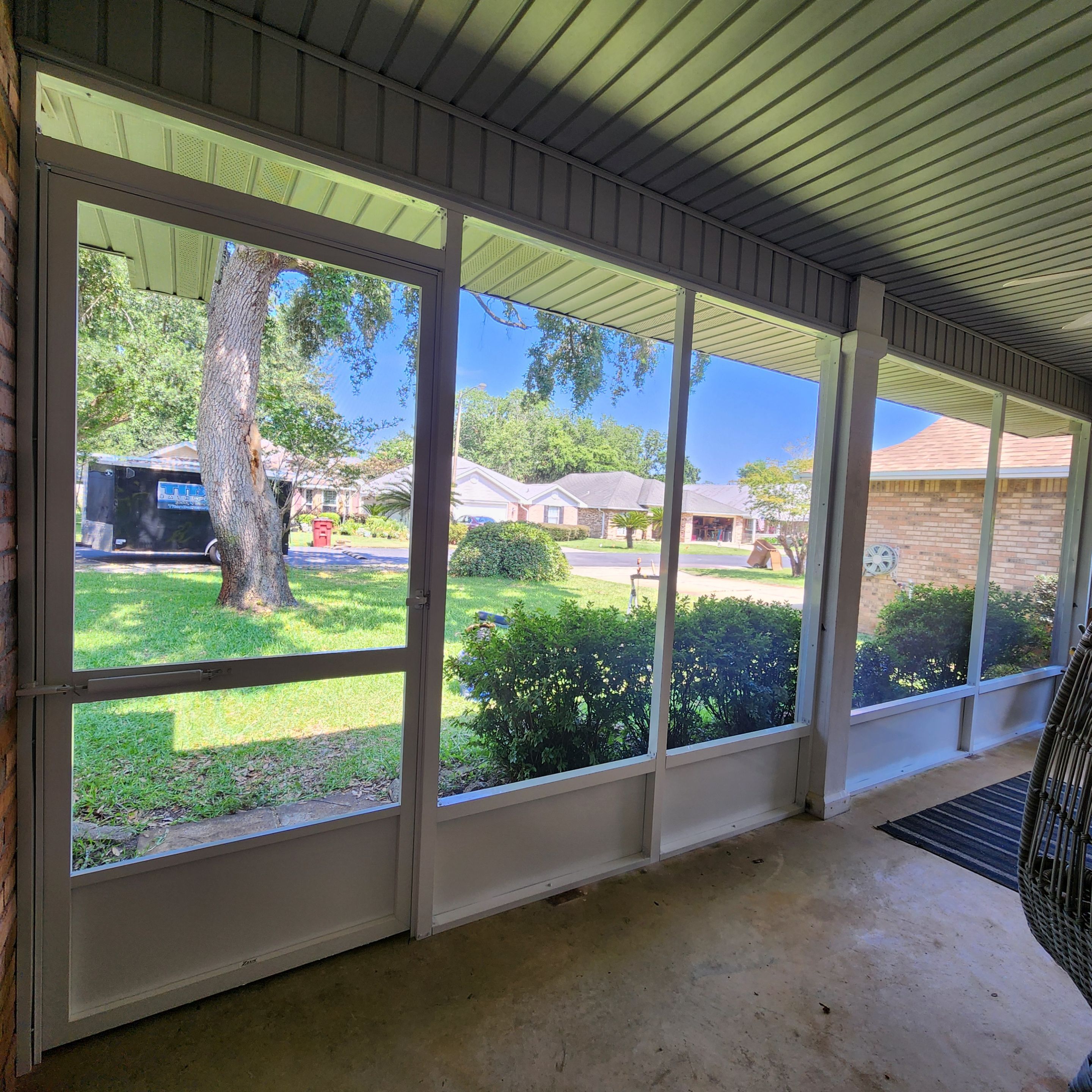 Screen Under Existing Patio Cover by Titan Sunrooms