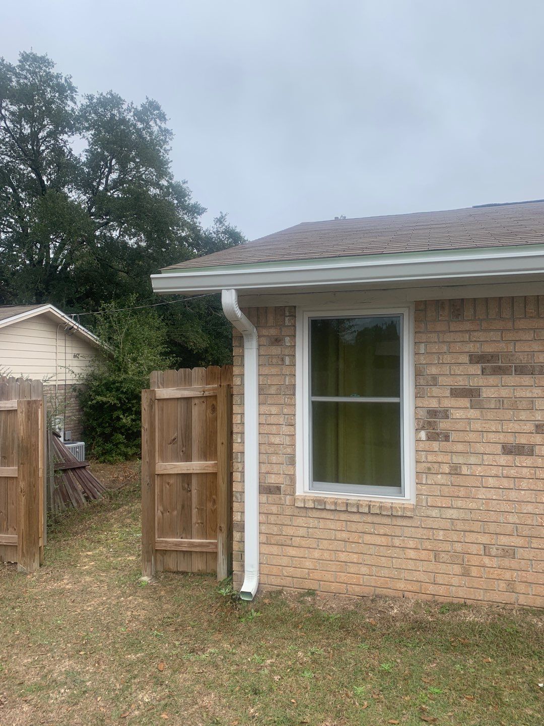 White Seamless Gutter Installation in Milton FL by Gutter Professors