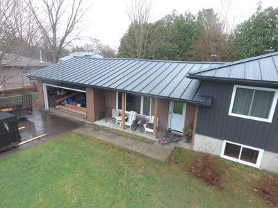 Residential Roofing Installation using 24 Ga Standing Seam Metal