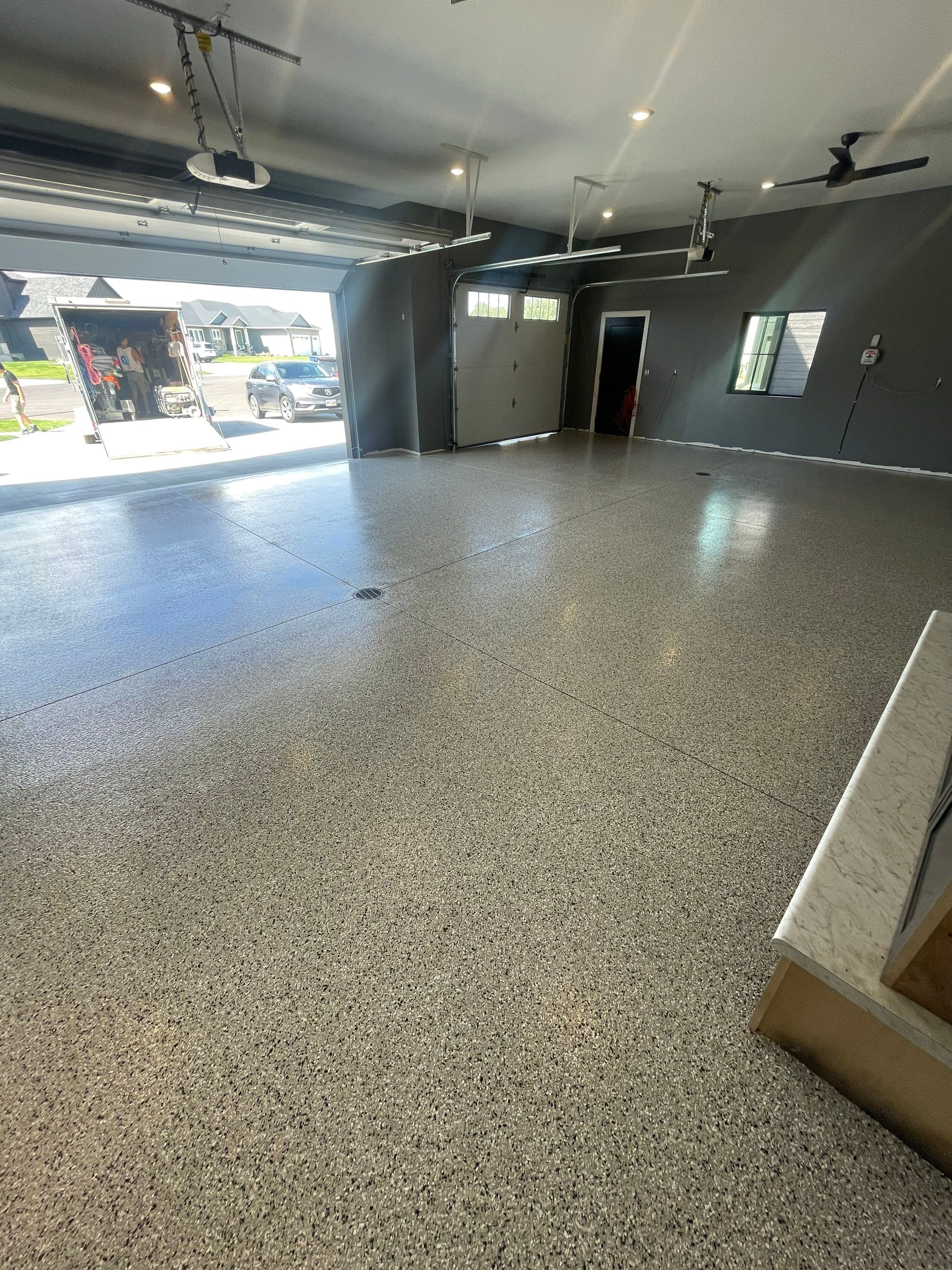 Custom Speckled Concrete Coating for Dell Rapids Garage by Select Painting, Coatings & Garage Cabinets