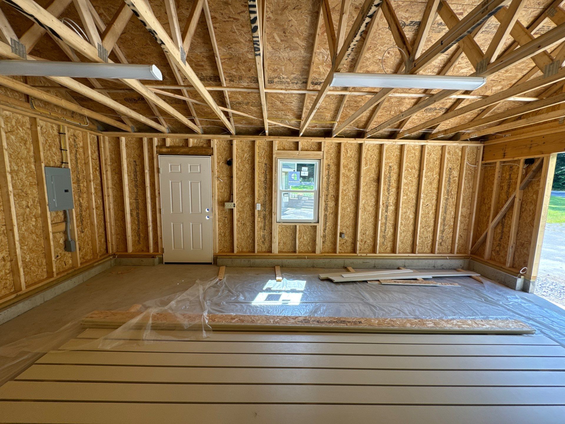 Two-Car Garage using LP SmartSide Panel Siding by Chagnon Building & Remodeling LLC