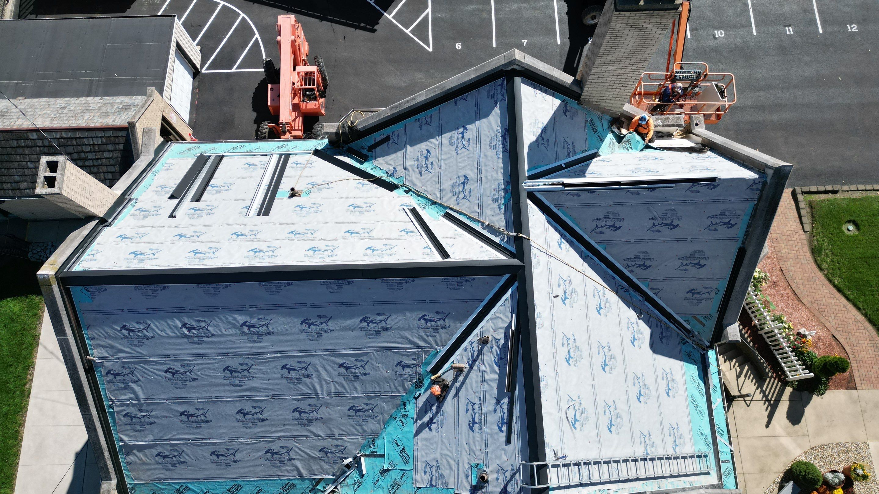Commercial Roofing Installation using Standing Seam Metal - Frost Black by RoofX 