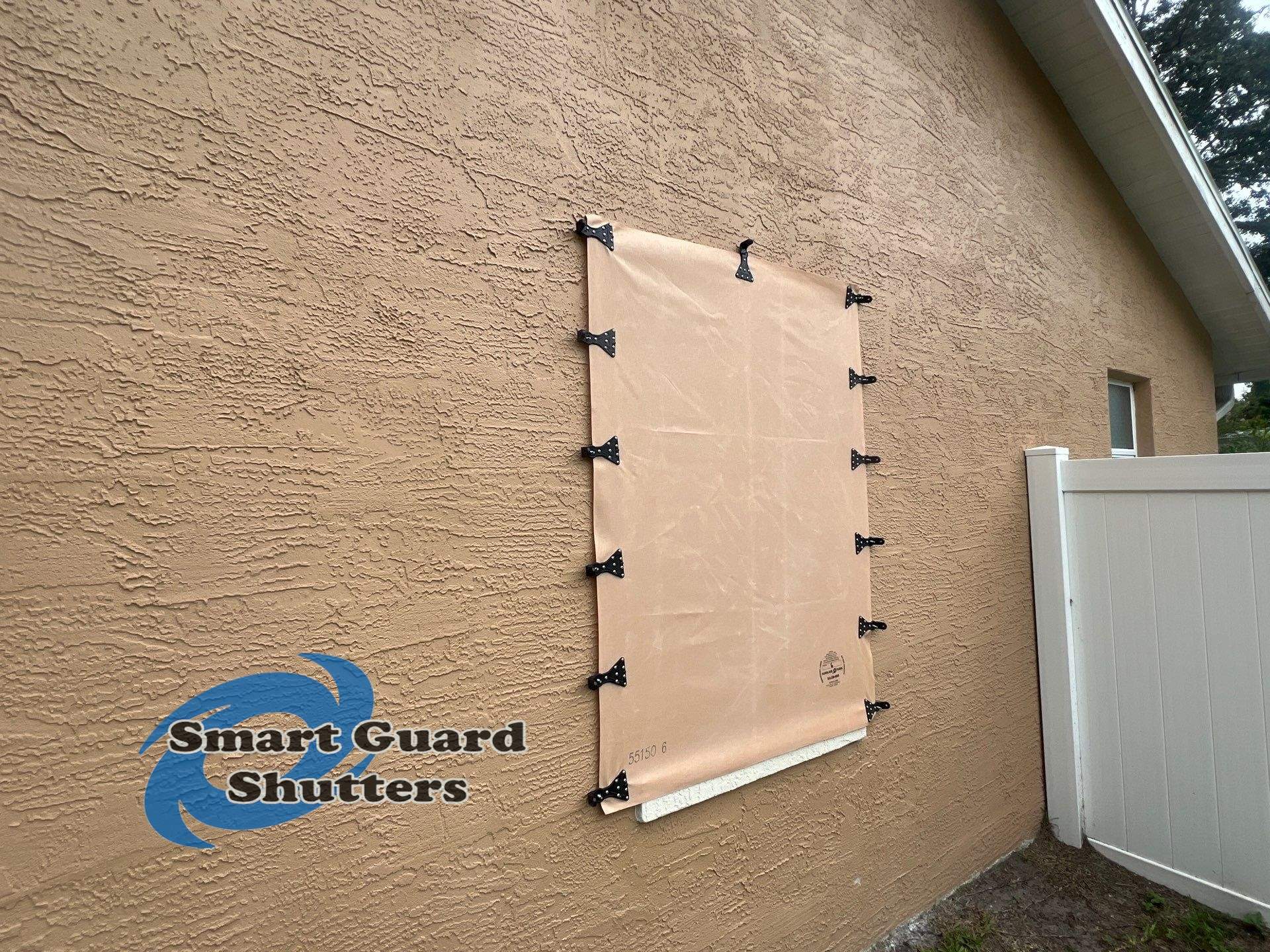AstroGuard Hurricane Fabric in Tan by Smart Guard Shutters