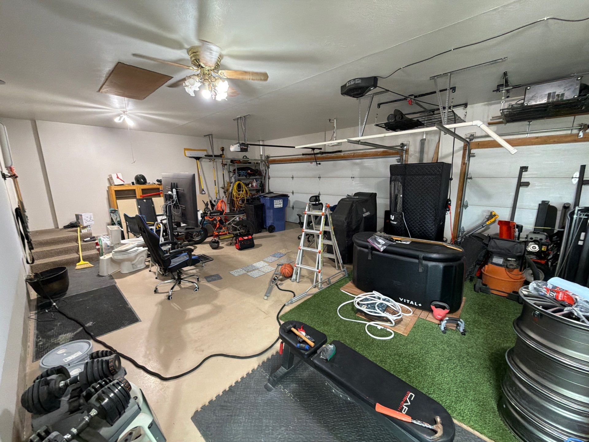 Residential Garage Floor Coating with Grey Speckled Epoxy Finish by Select Painting, Coatings & Garage Cabinets