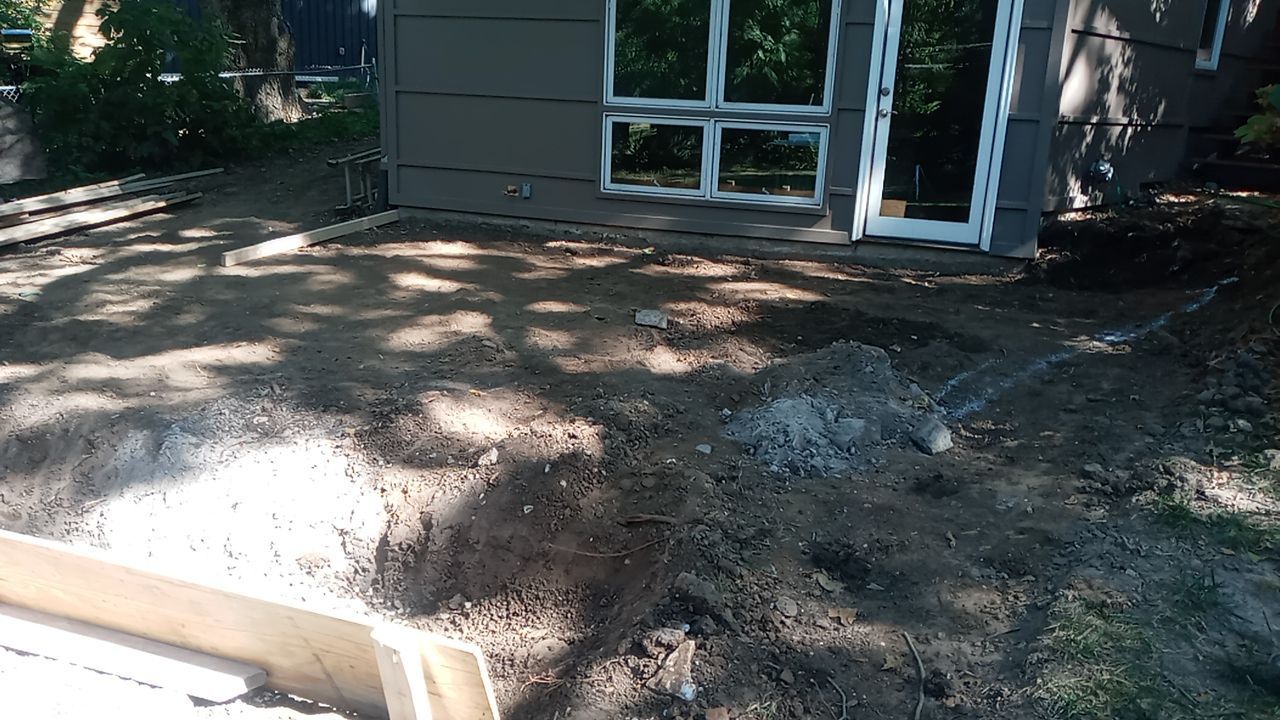 Back Yard Cantilivered Patio by LAND ESCAPES LLC